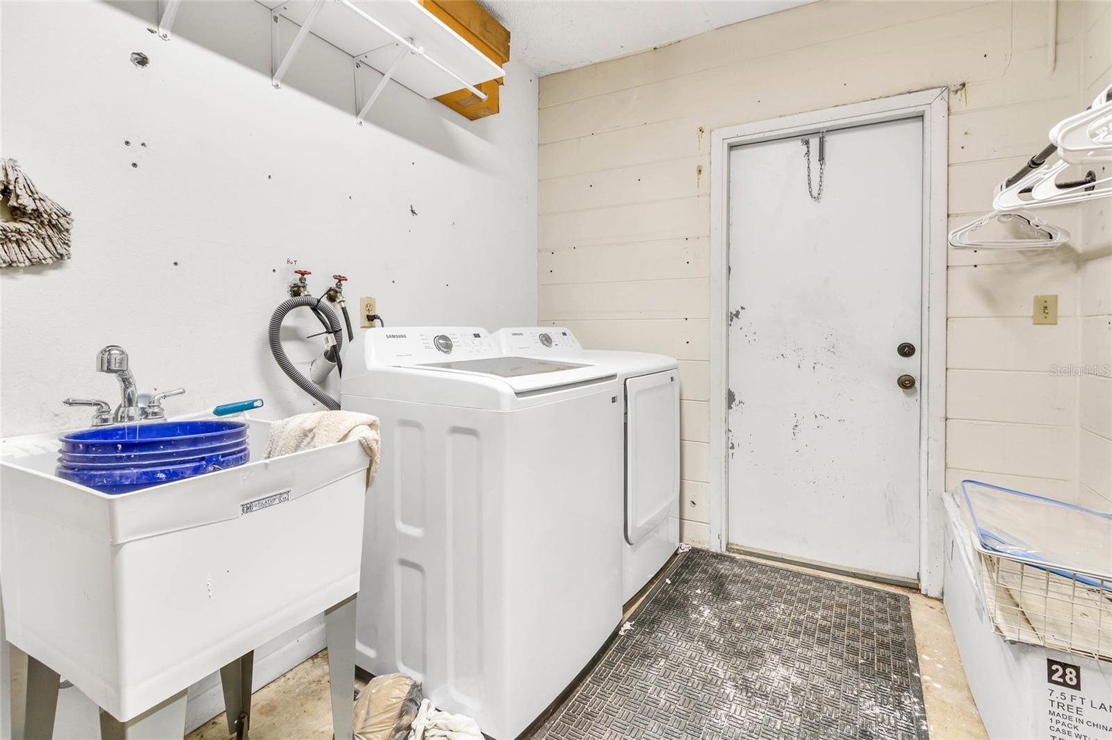 Laundry Area With Access To Backyard