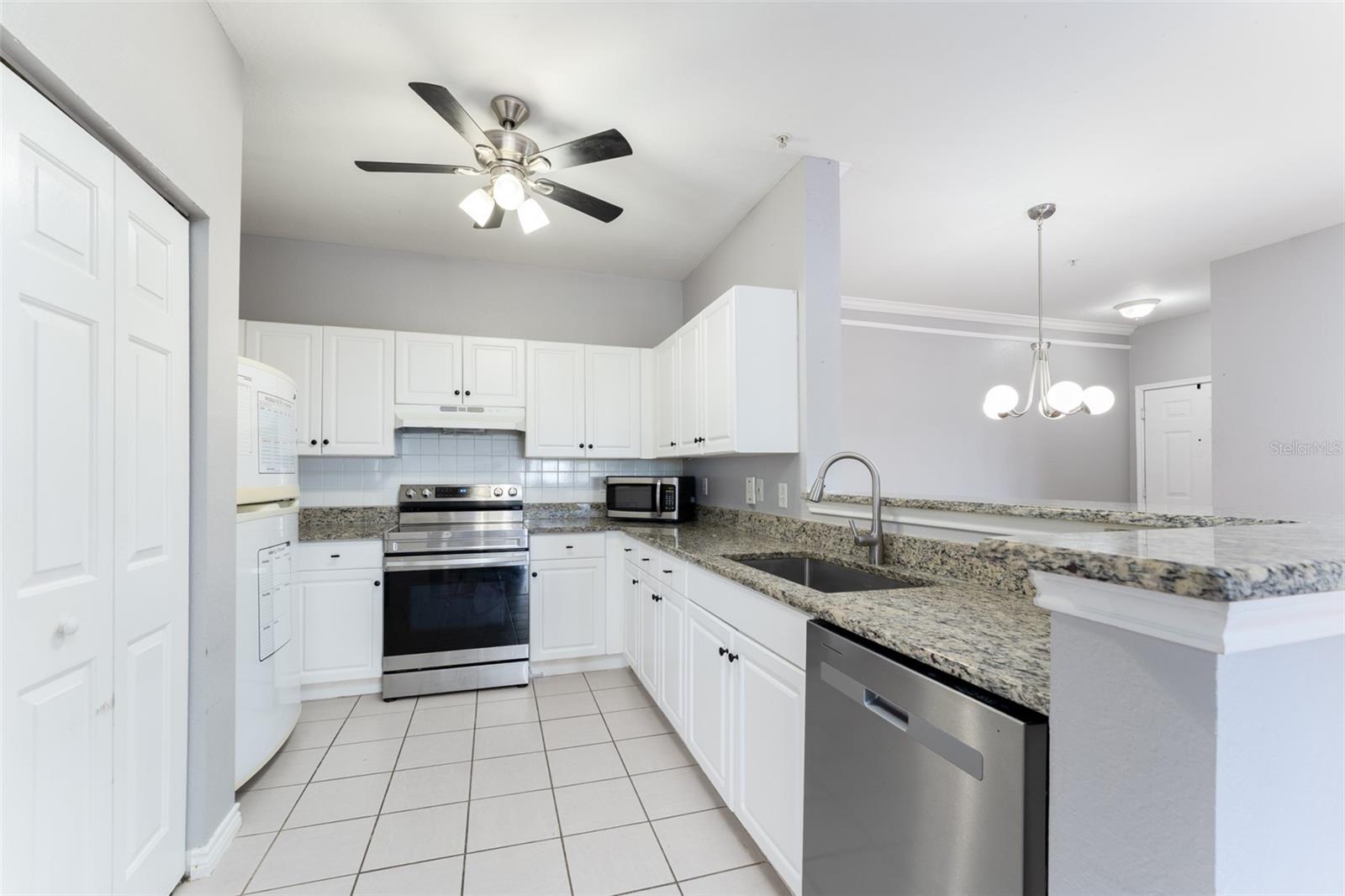 kitchen countertops are granite & all appliances convey