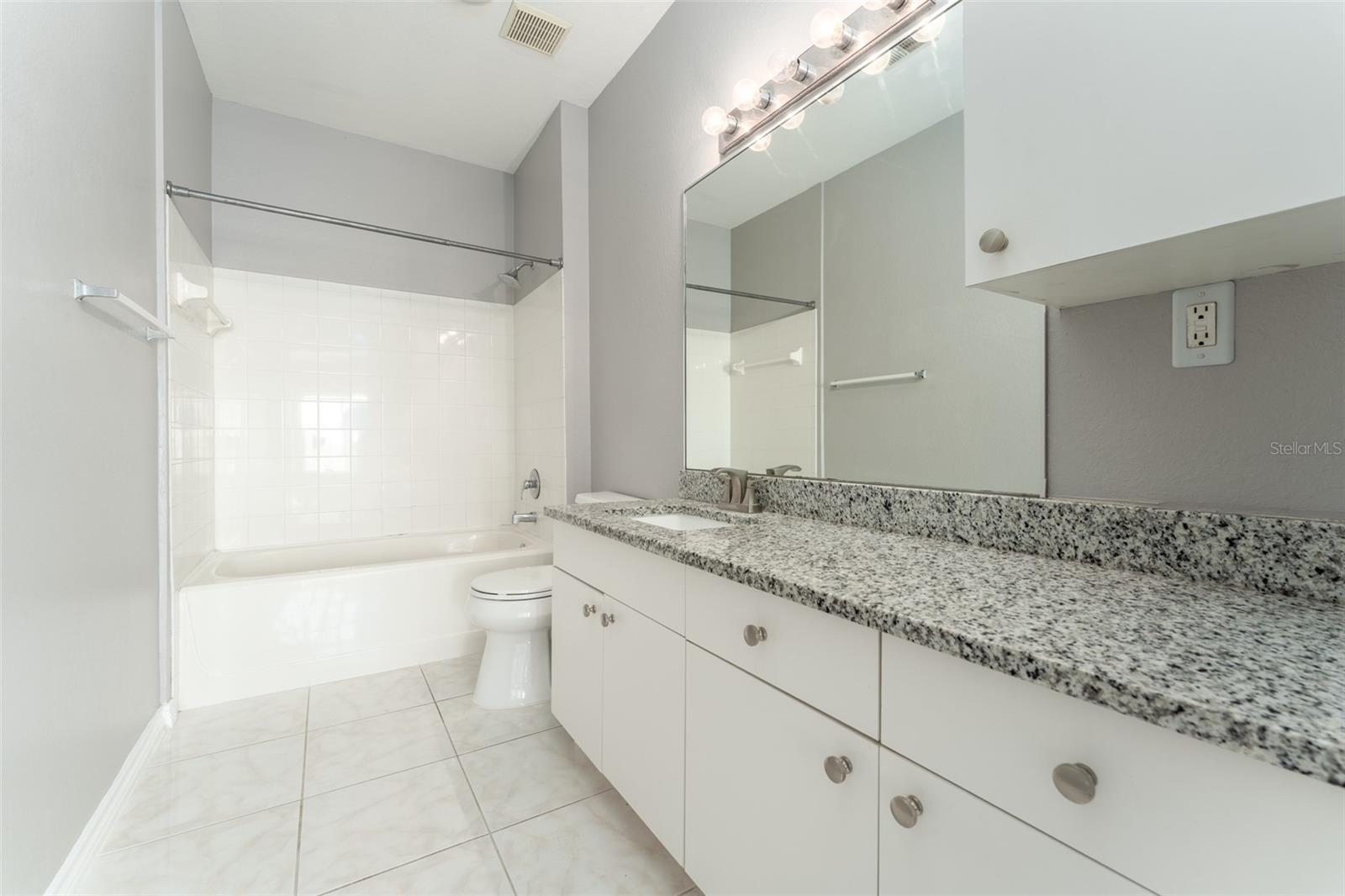 primary bath with granite countertops