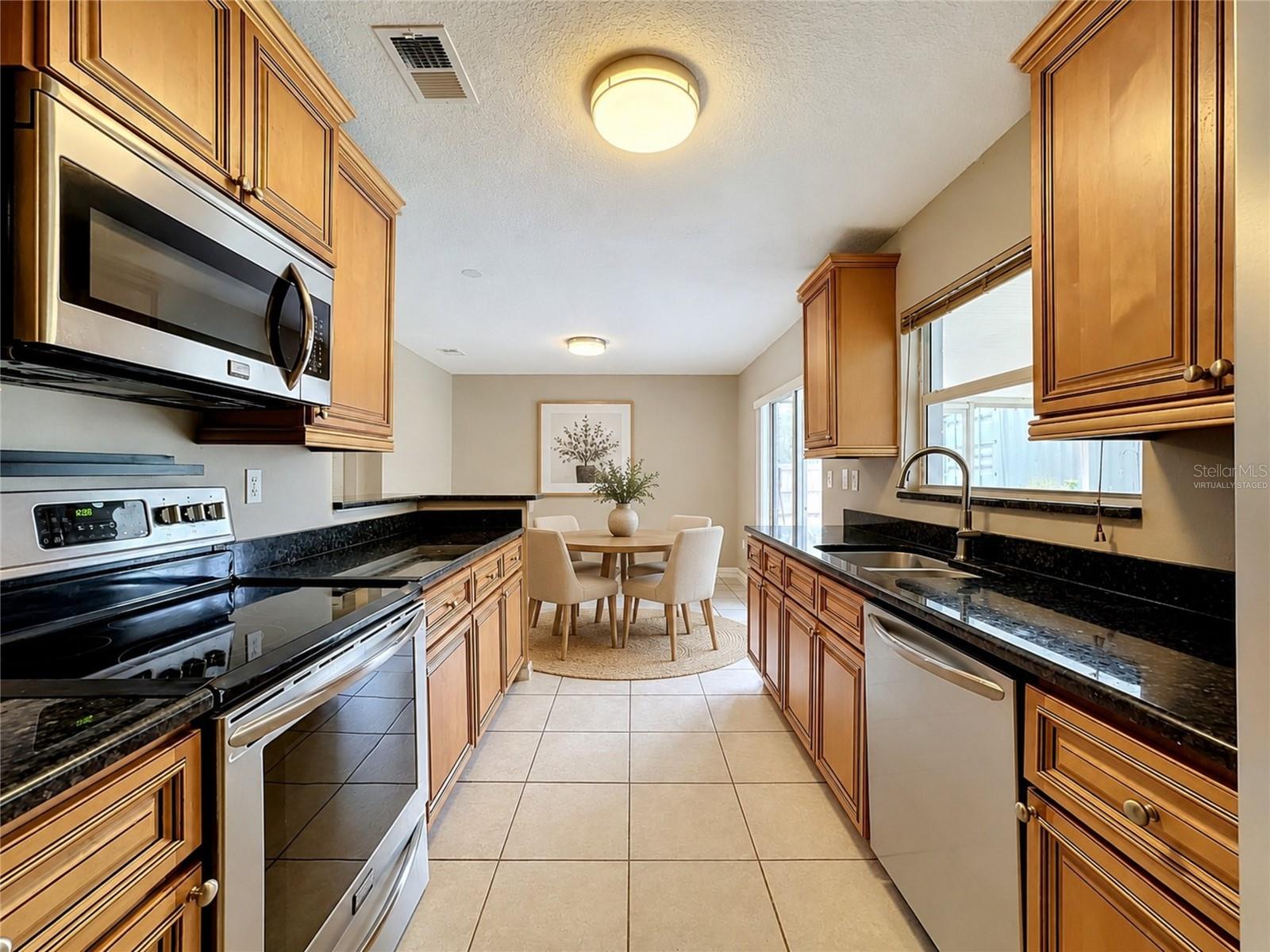 VIRTUALLY STAGED: Galley Kitchen | Dining Room