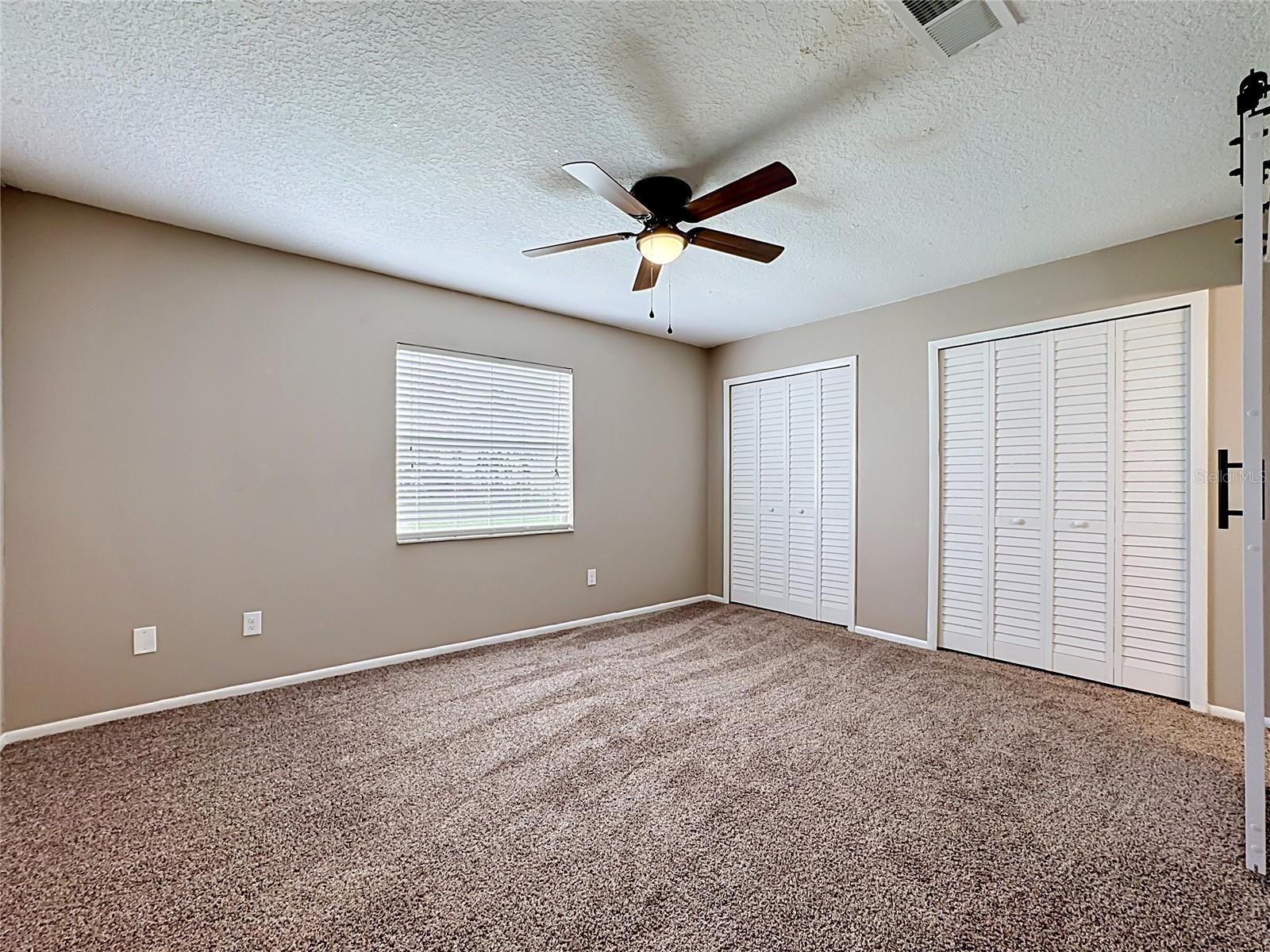 Primary Bedroom (View Two)