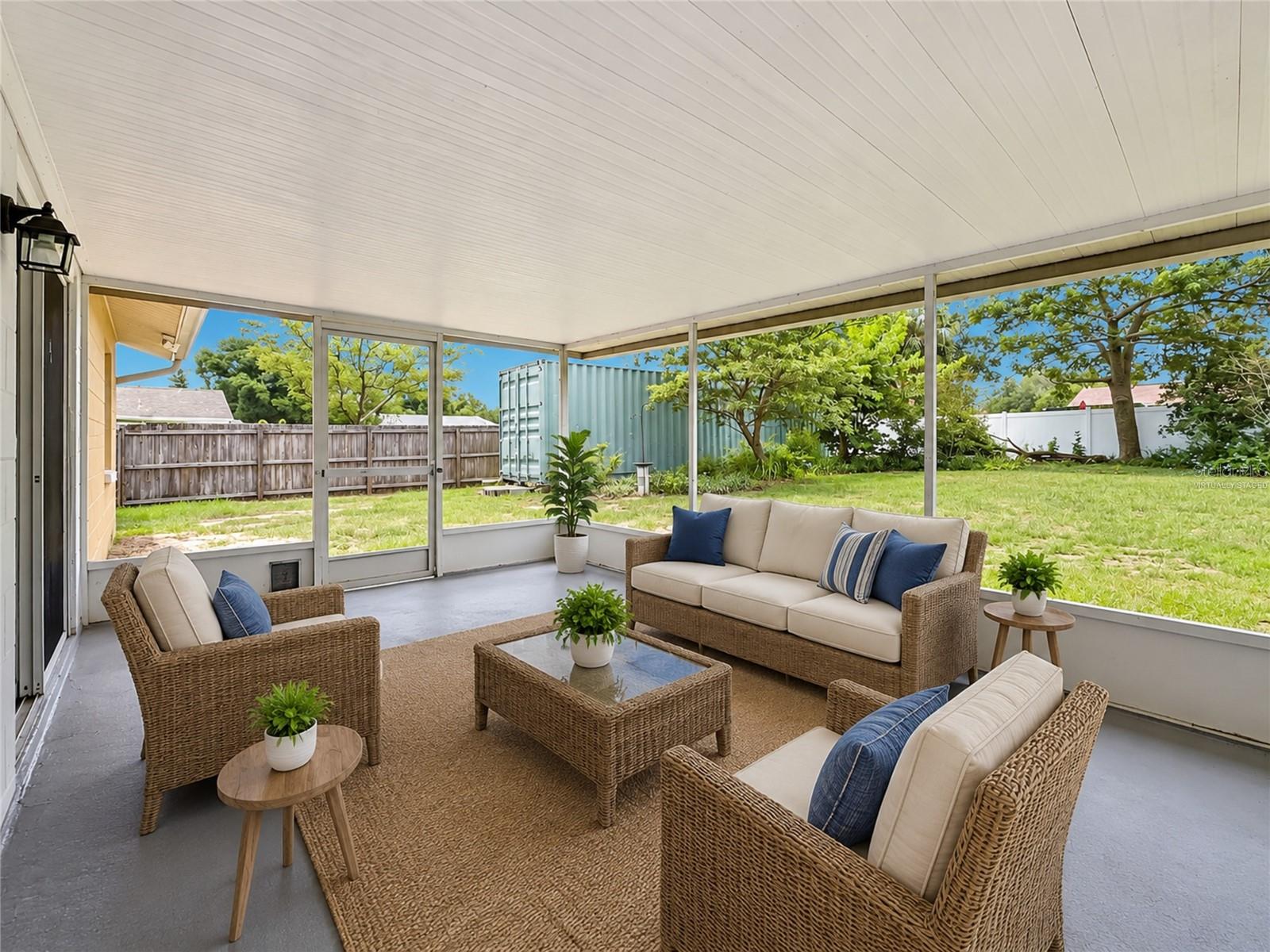VIRTUALLY STAGED: Rear Screened Lanai (View Two)