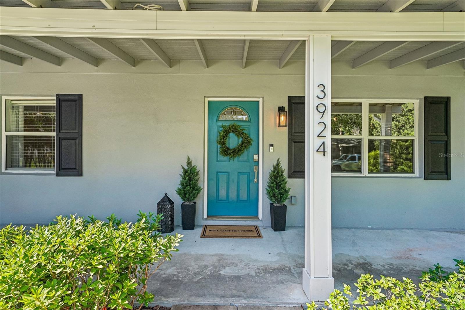 Classic covered front porch spans the front of the home.