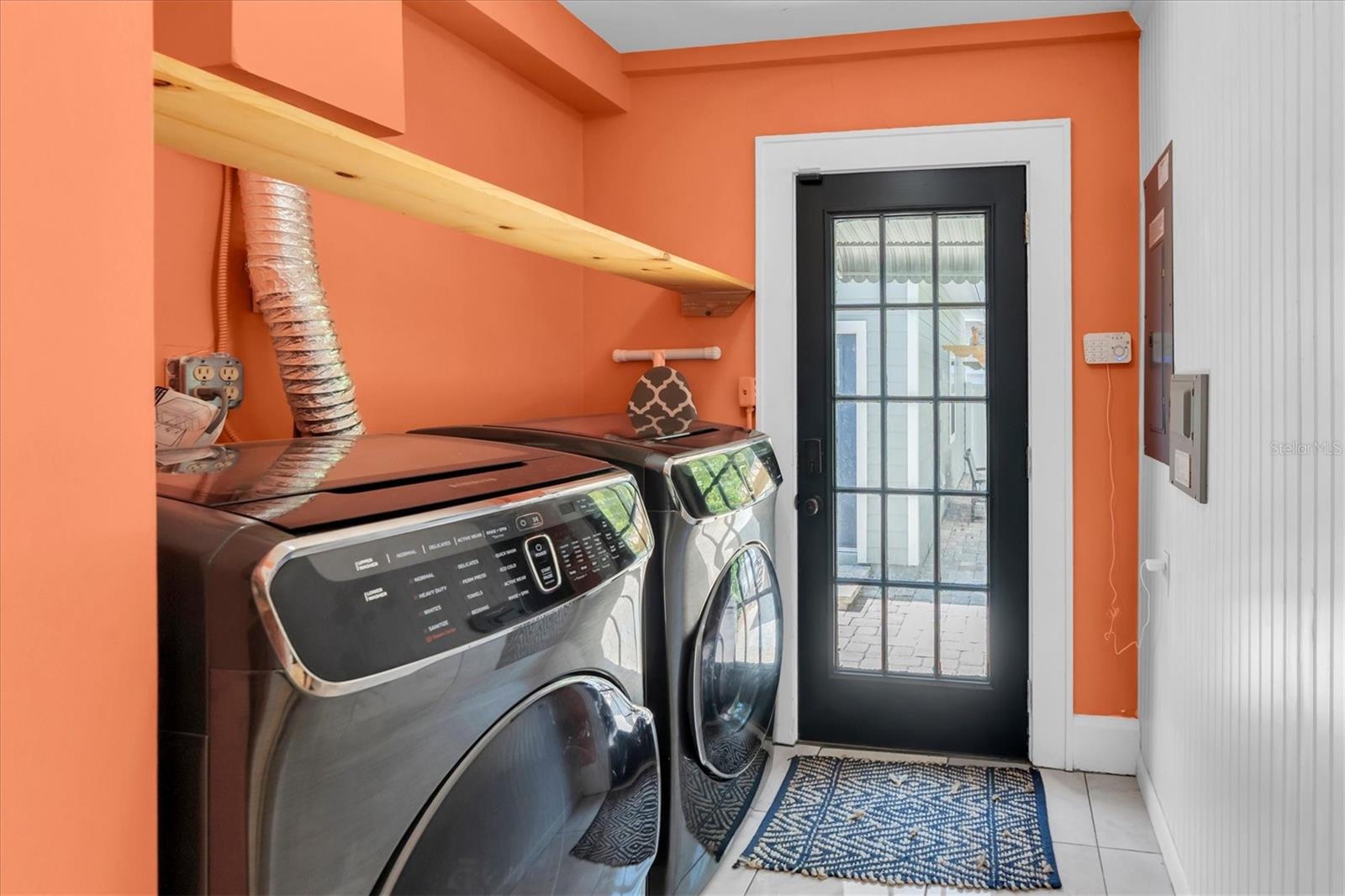 Laundry room off the Kitchen.  Back door leads to garage & rear patio.