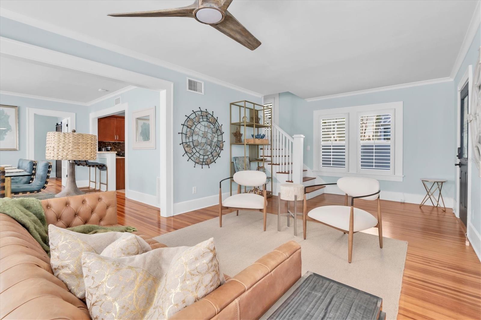 Living Room.  Staircase to 2nd Floor in back left. Dining room & Kitchen to the immediate left.