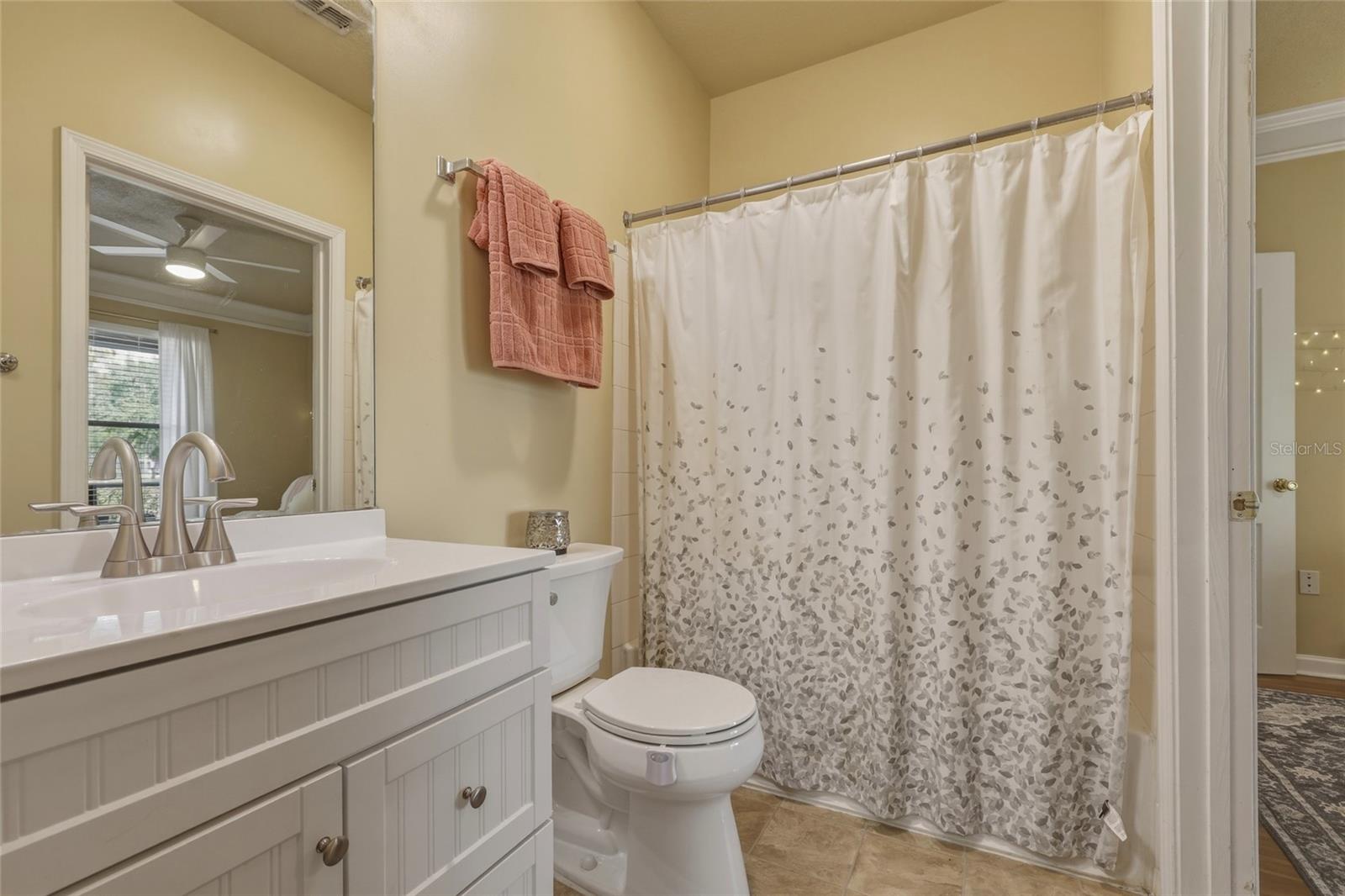 Bathroom with newer vanity, faucet and toilet