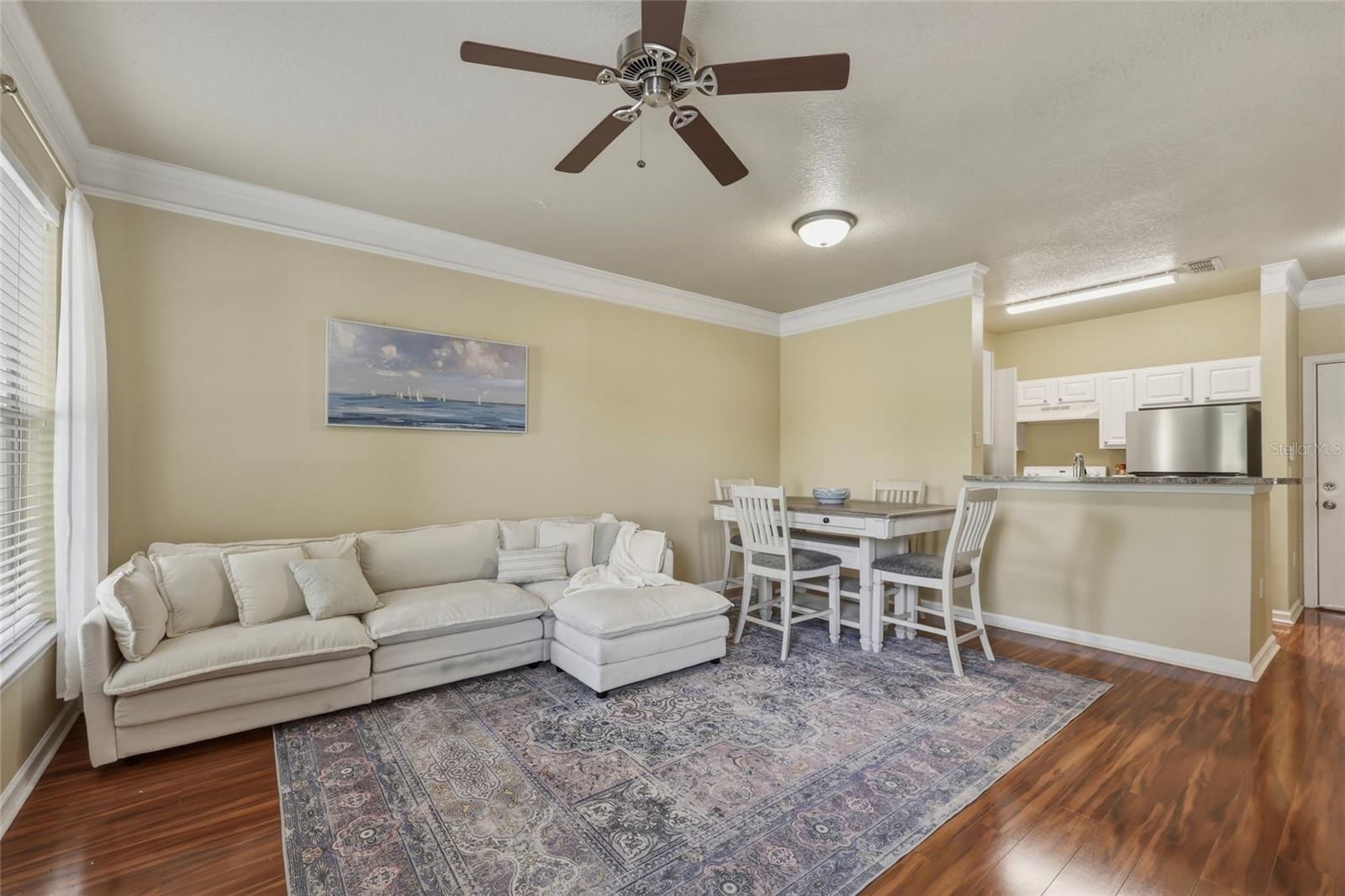 Living Room and Dining Area with Wood Laminate Flooring