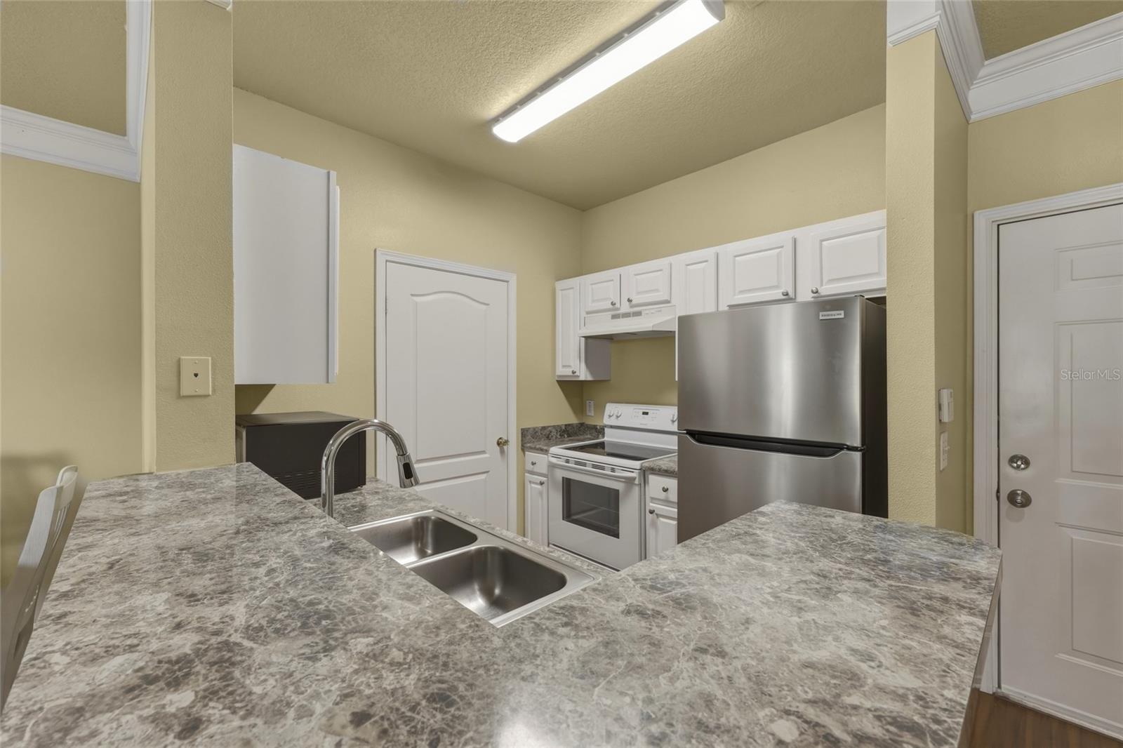 Garage entry to the right of the Kitchen