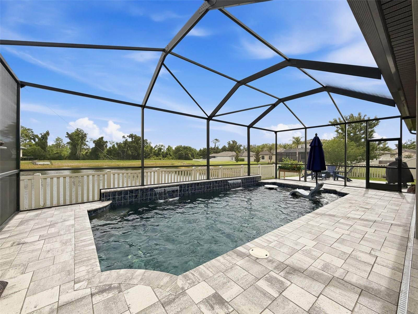 Relax on this spacious lanai with water and conservation views