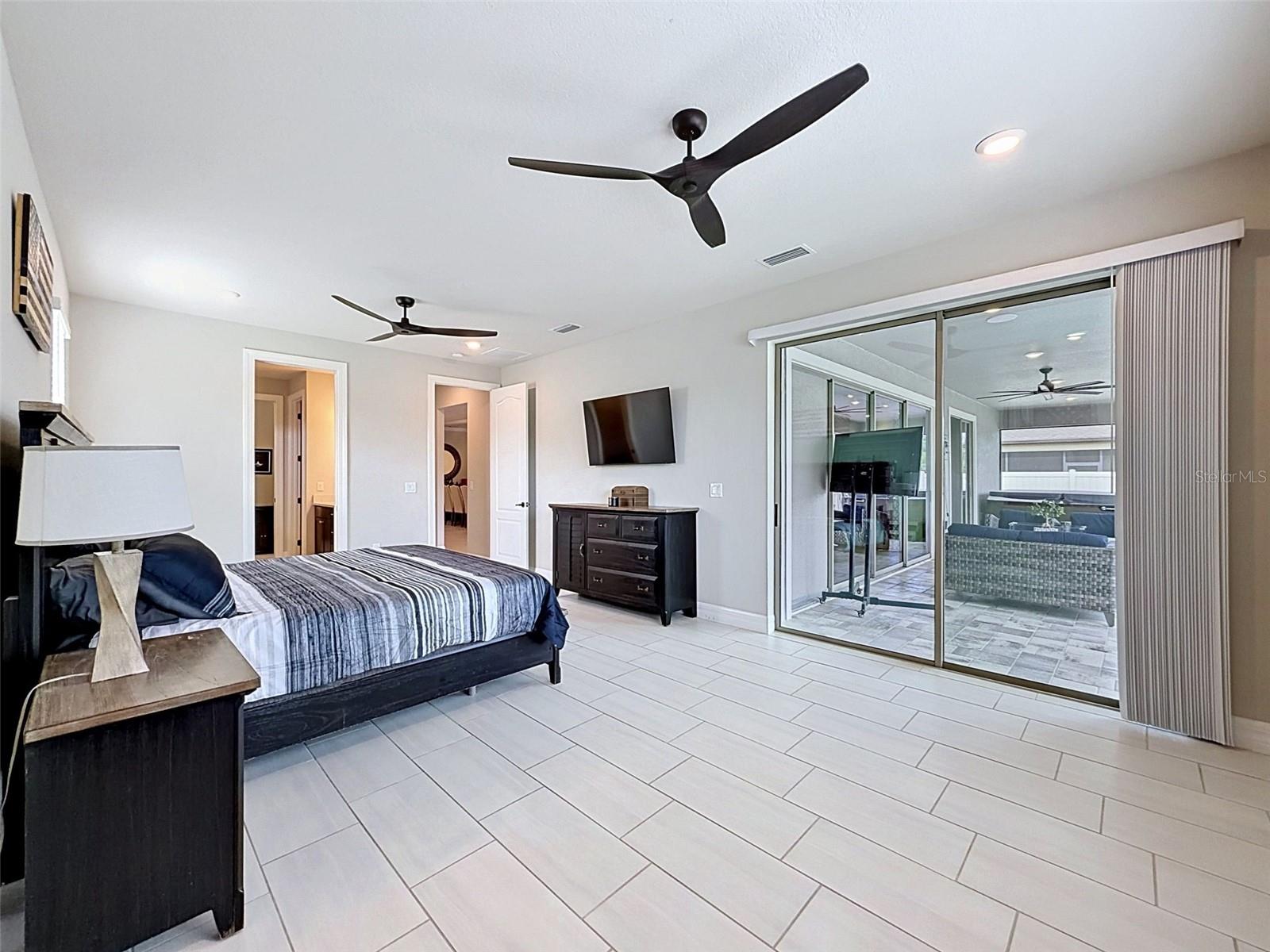 Primary bedroom with access to the pool area