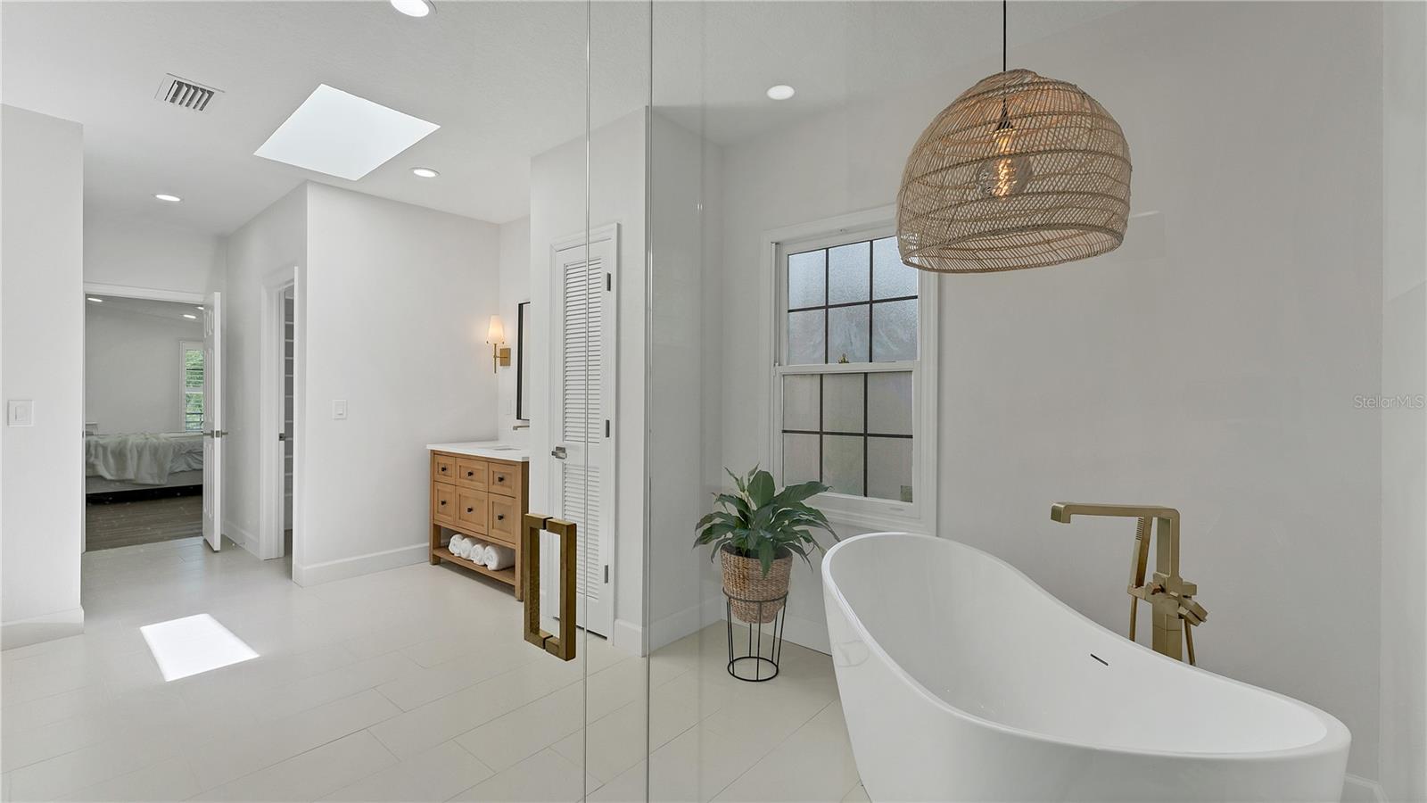 Primary ensuite bath looking to bedroom
