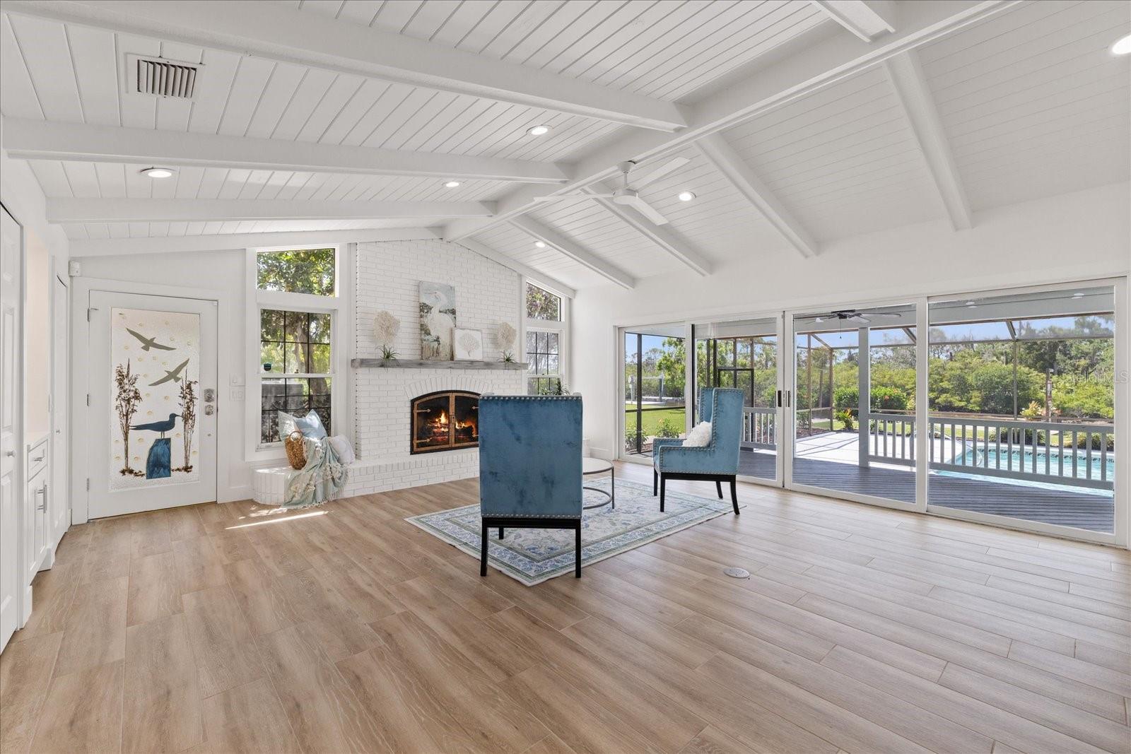 Grand living room with gas fireplace.
