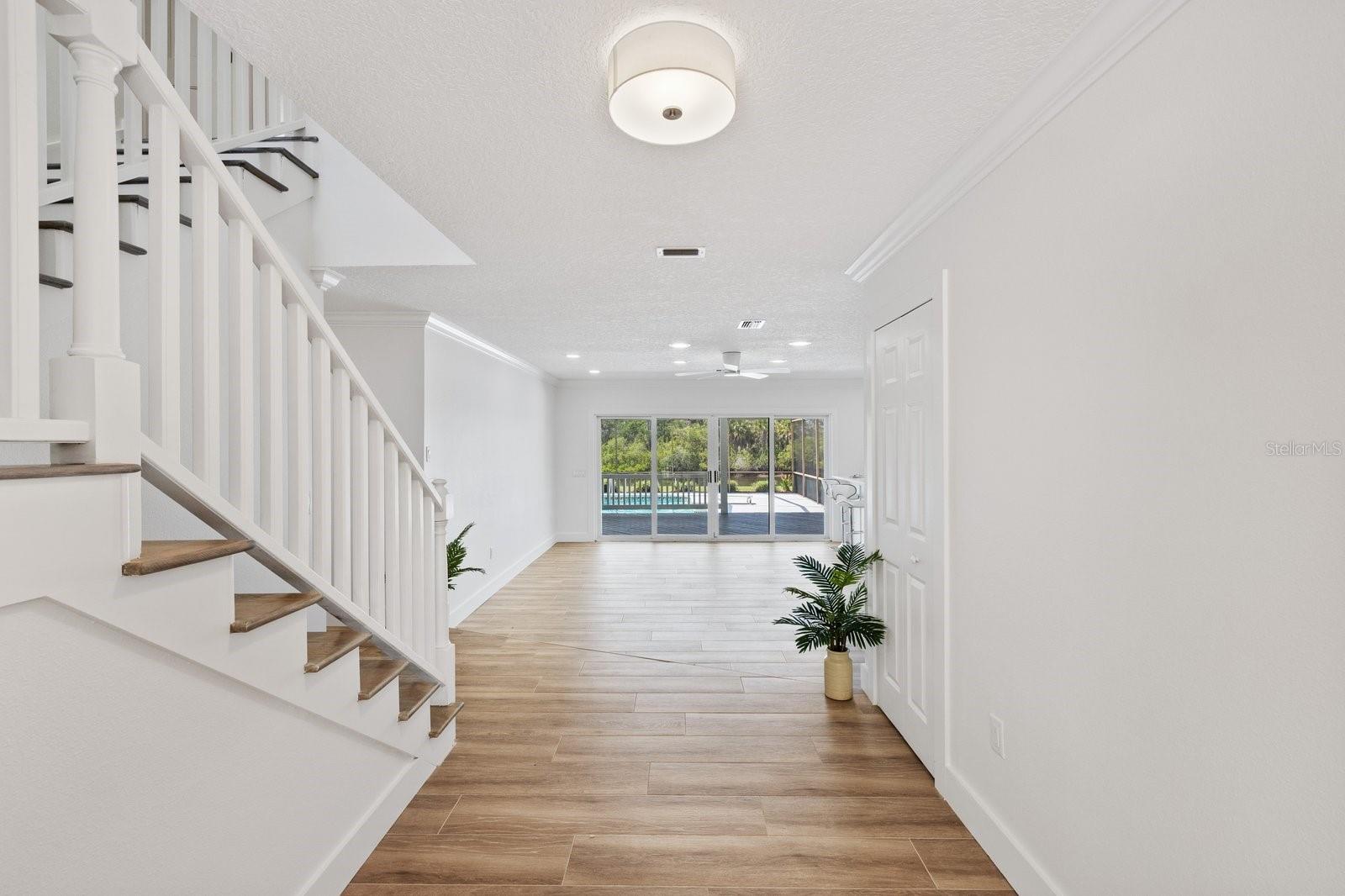 Front Door entry and stair way to 3 bedrooms/2 bathrooms