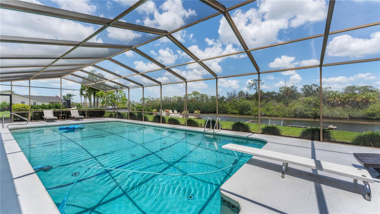 Large pool with screen enclosure
