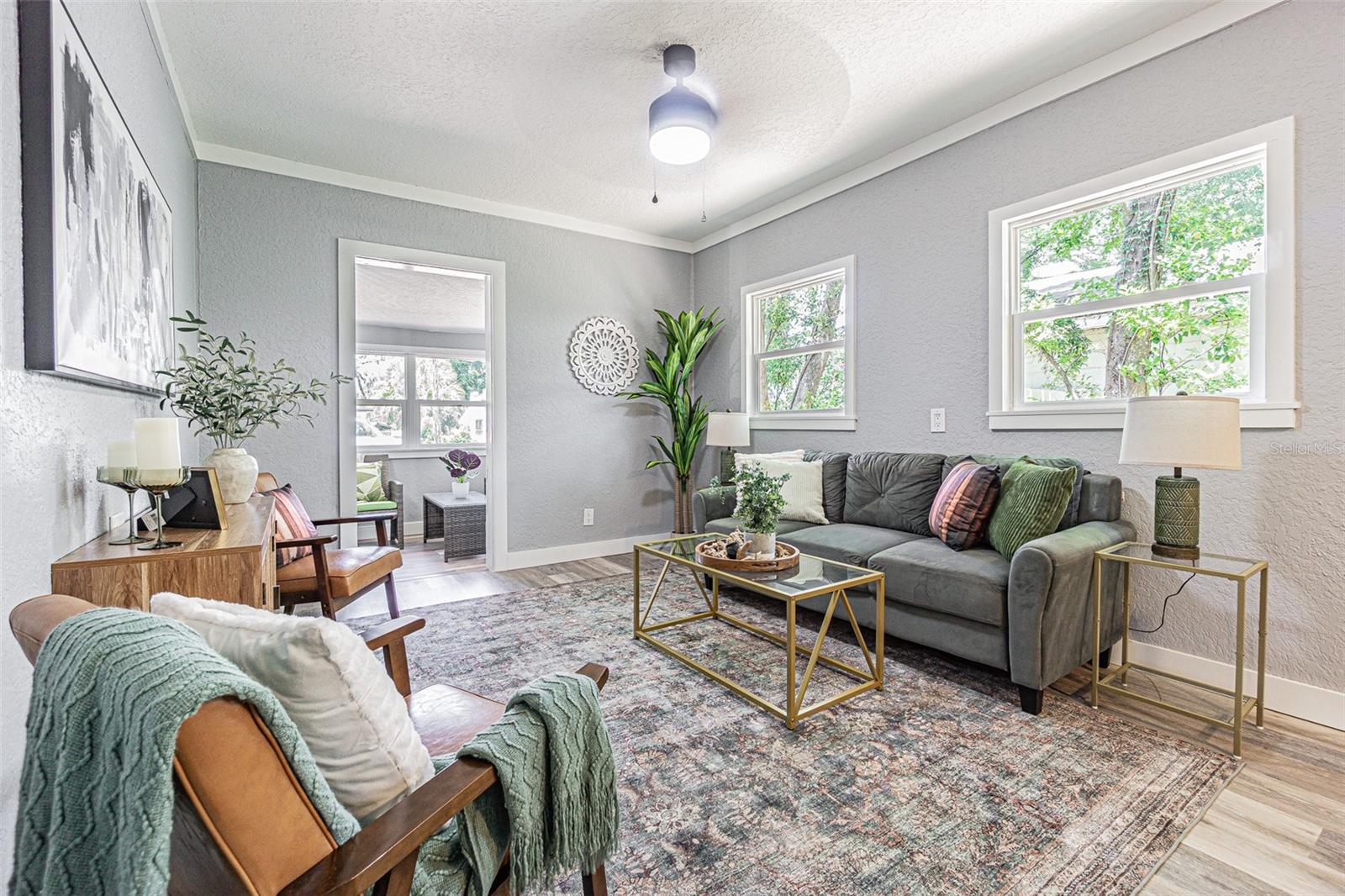 From the sitting porch to the living area, you'll be charmed by this bungalow