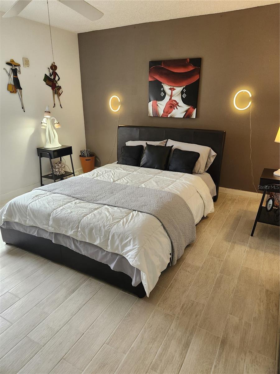 Spacious bedroom with new tile floors