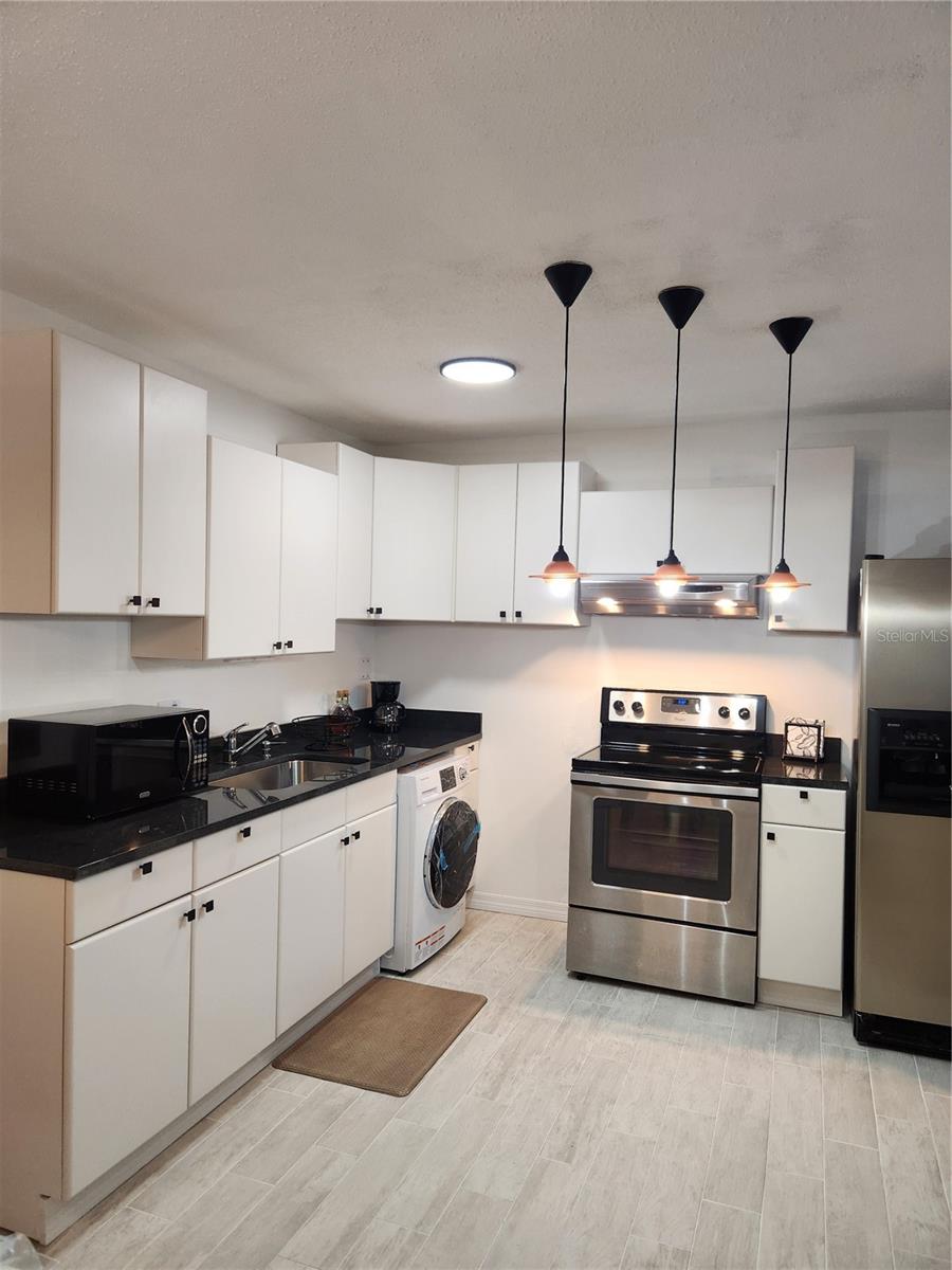 Open Kitchen, granite counter tops and newer appliances