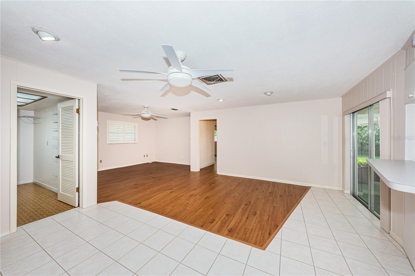 Spacious Family room with doors to lanai and pool