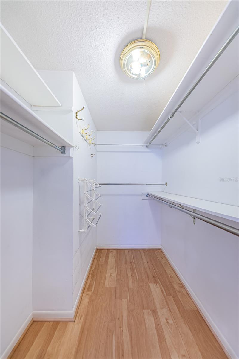 Walk in closet in primary bedroom