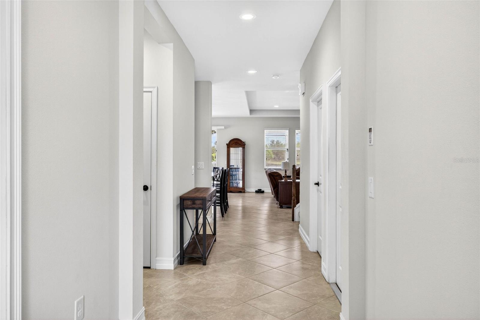 Bright and open entryway with high ceilings.