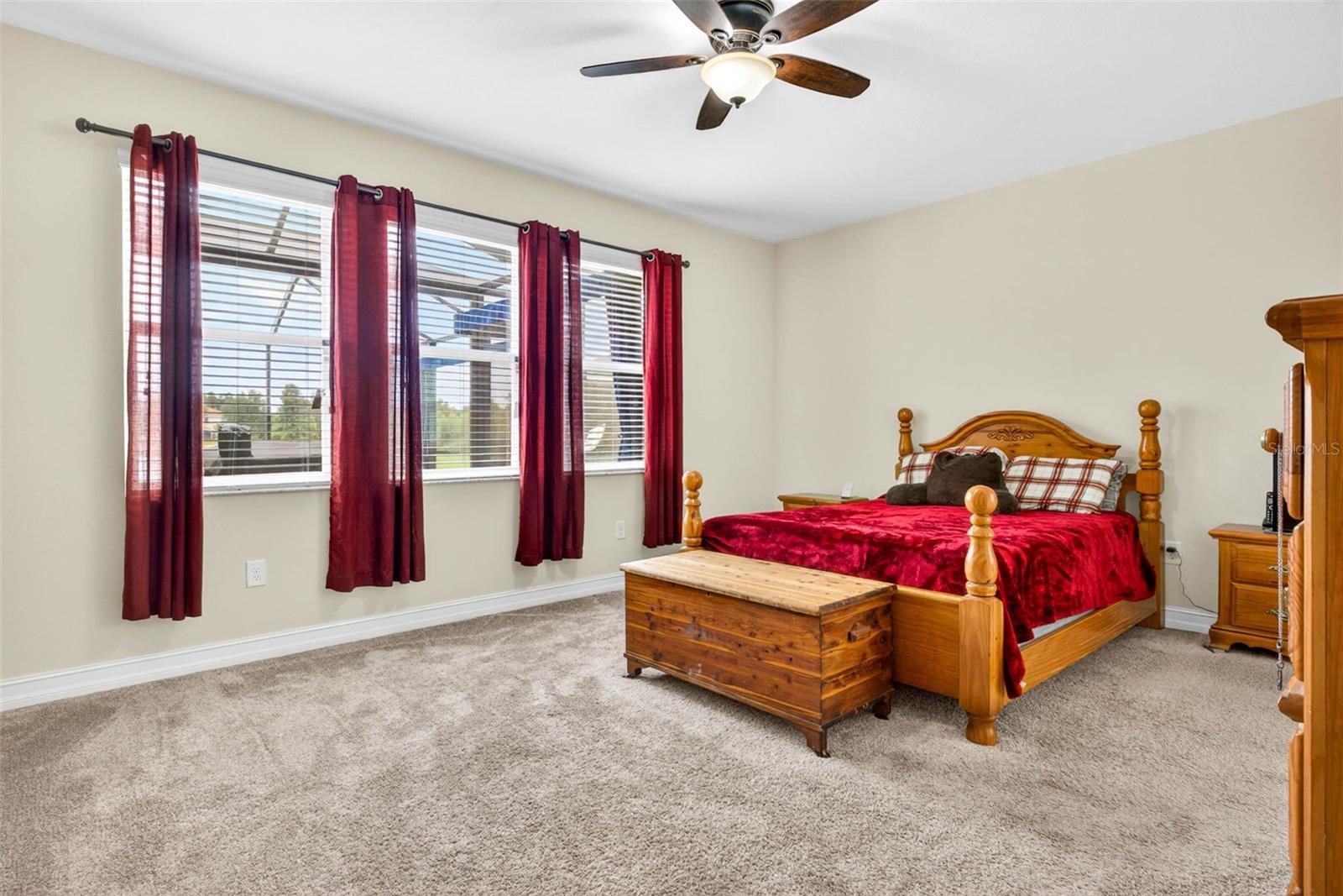 First floor primary has abundant space for full bedroom set and seating area.