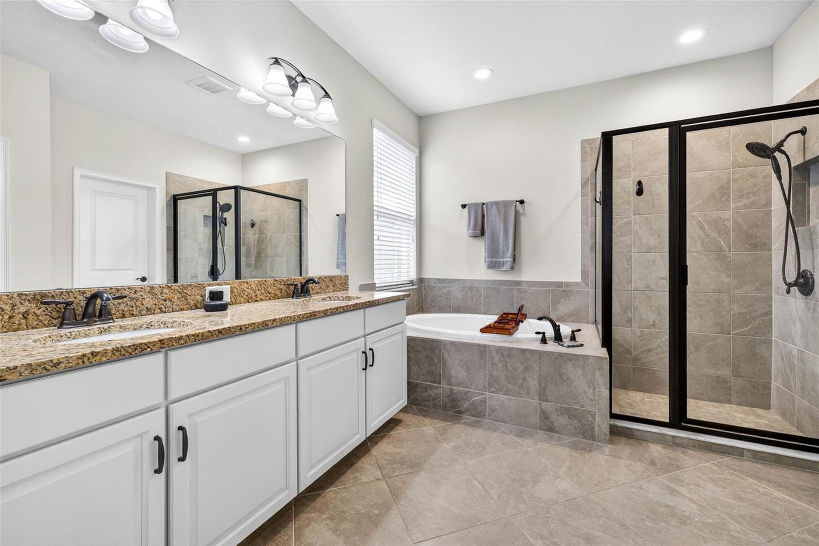 First floor full bath in the primary suite
