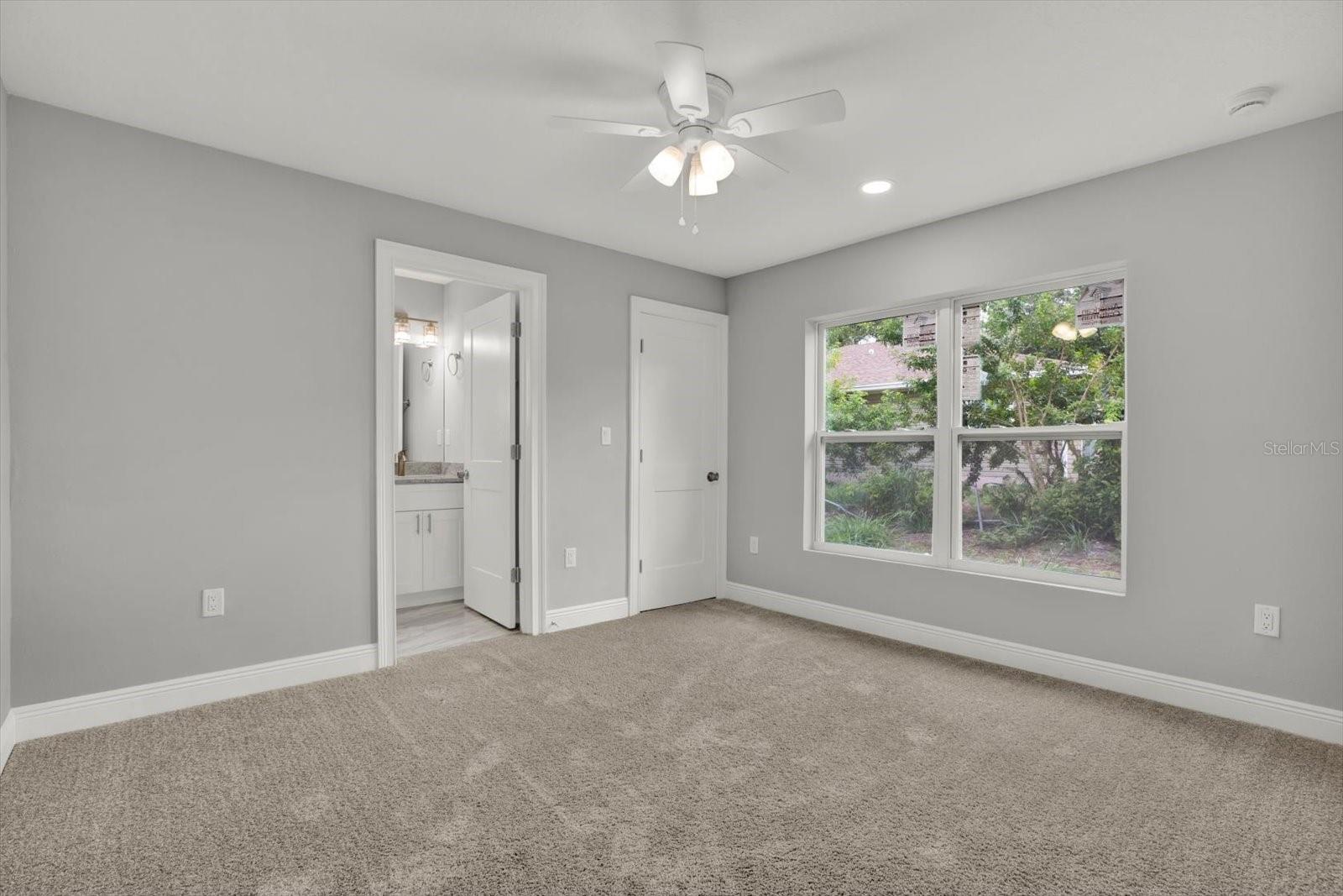 Primary bedroom ;ocated in the back of the house