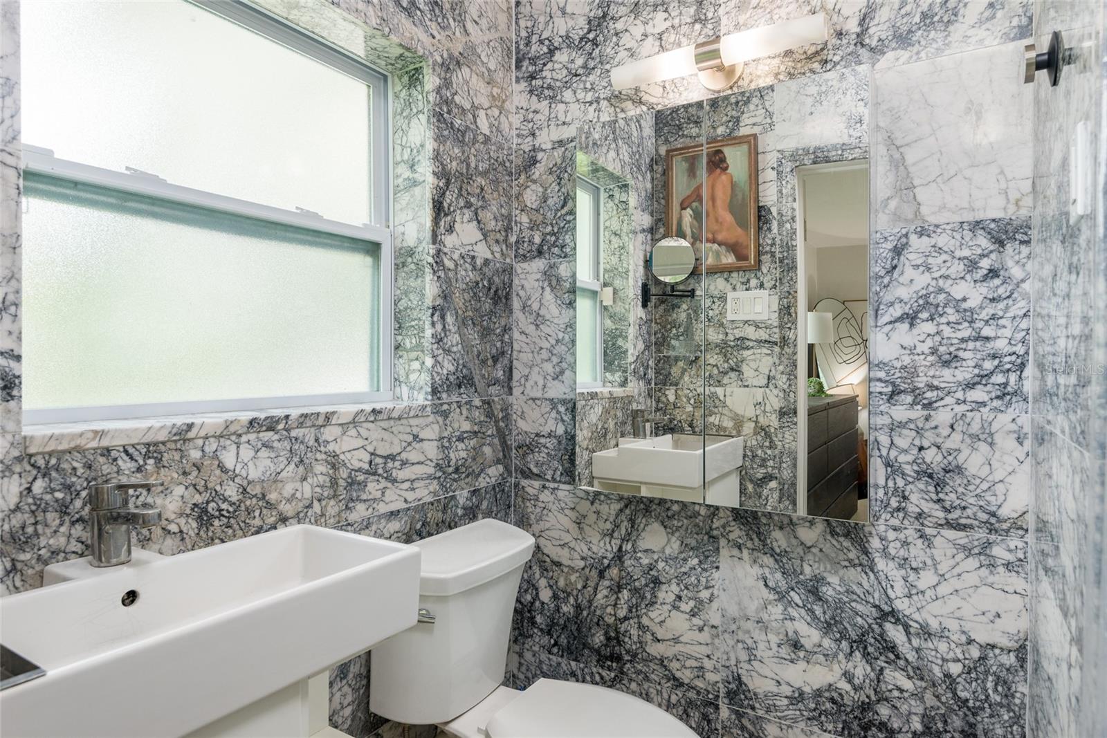 Primary Bathroom with exotic Milas Lilac Marble