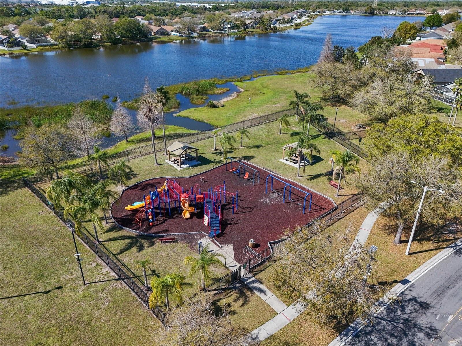 Community park, lake, picnic and walking areas with basketball courts