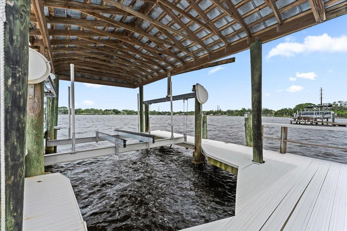 dock with and boat cover and a 12,000 lb lift