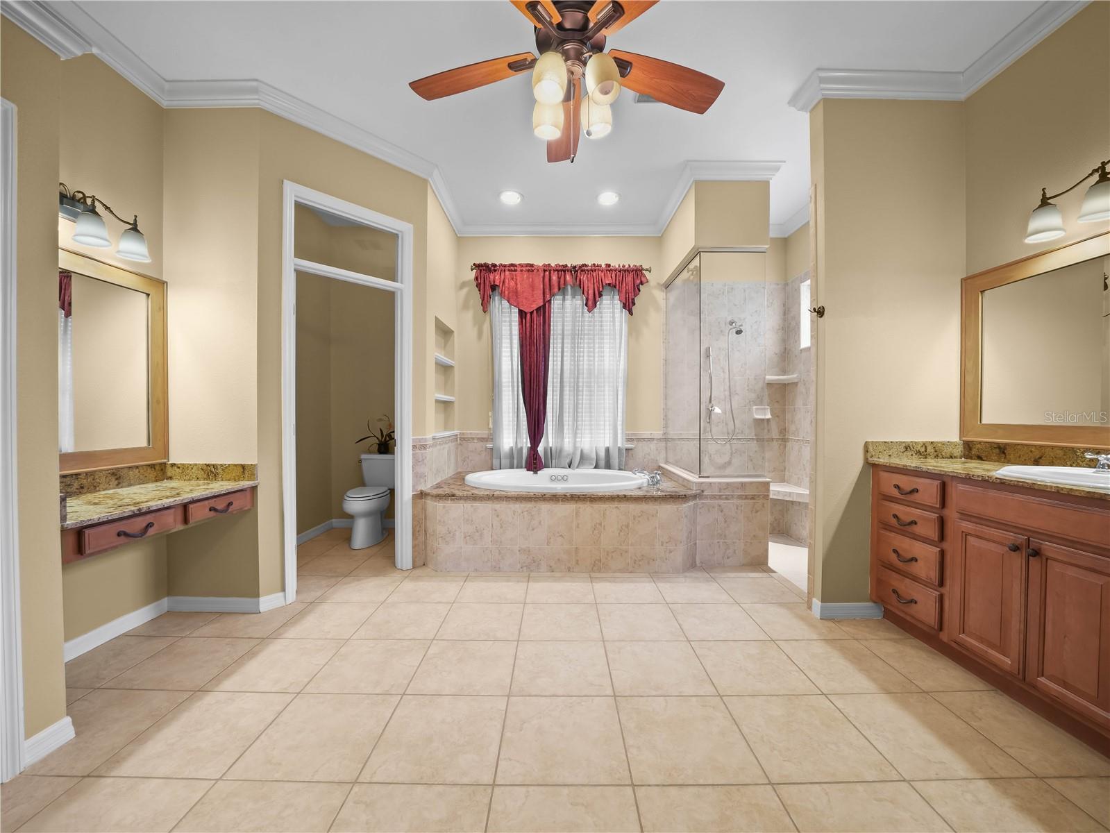 Luxurious 15x14 Primary 1 Bath complete with garden tub with Whirlpool, vanity and oversized shower.