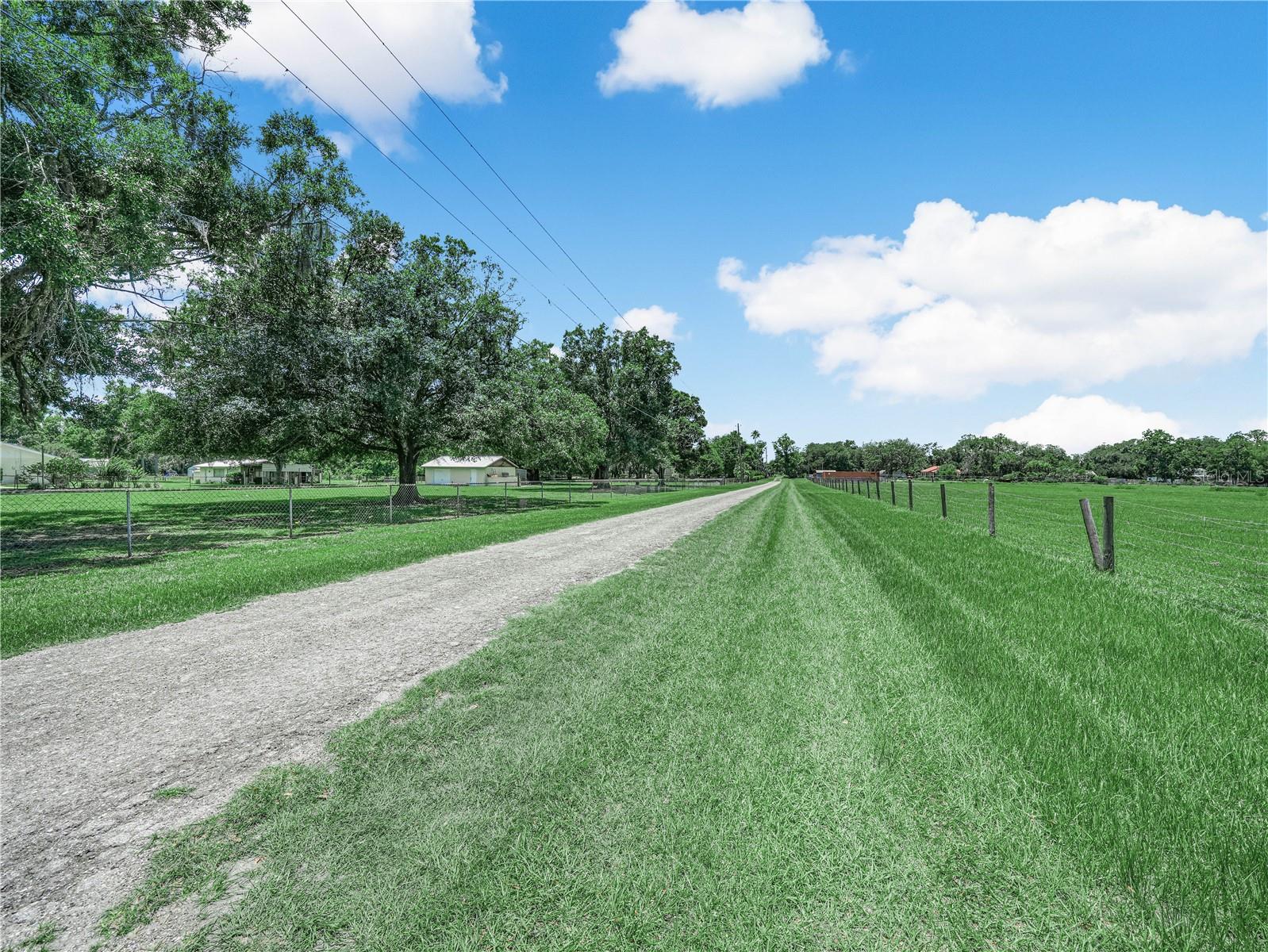 Gravel road leading to property.  Off the main road, providing more seclusion and reduced traffic noise.