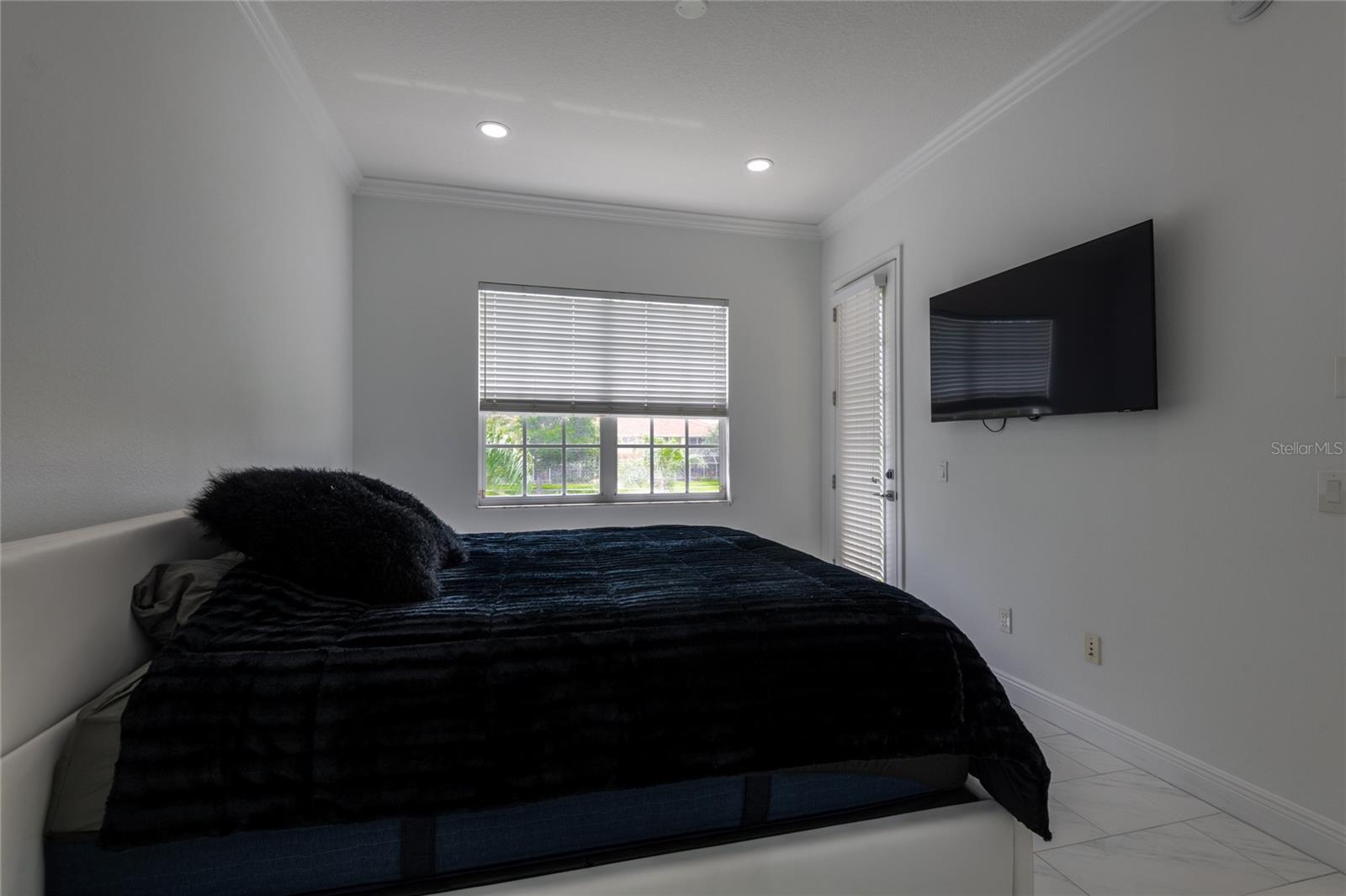Another view of the Master bedroom with private door to the screen lanai.