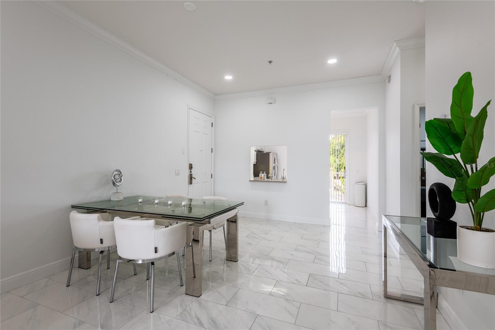 Dining area with pass thru window from kitchen