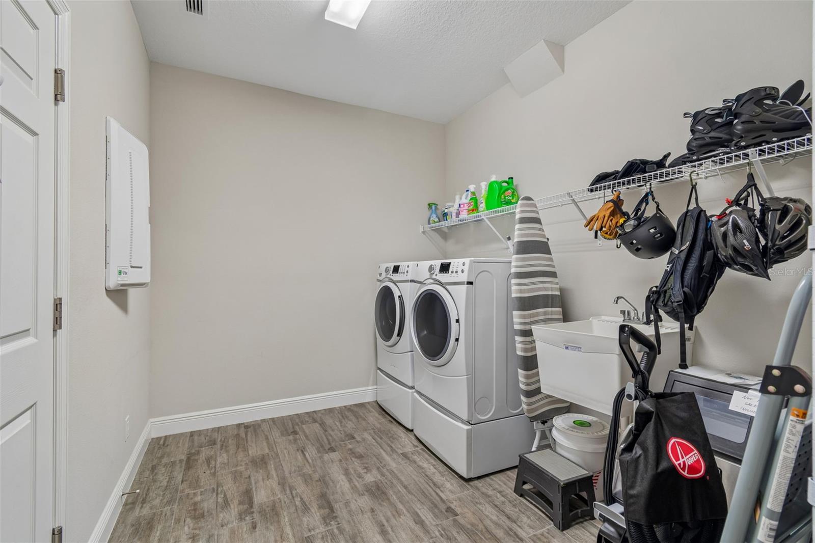 Large utility room washer and dryer convey with sale of home