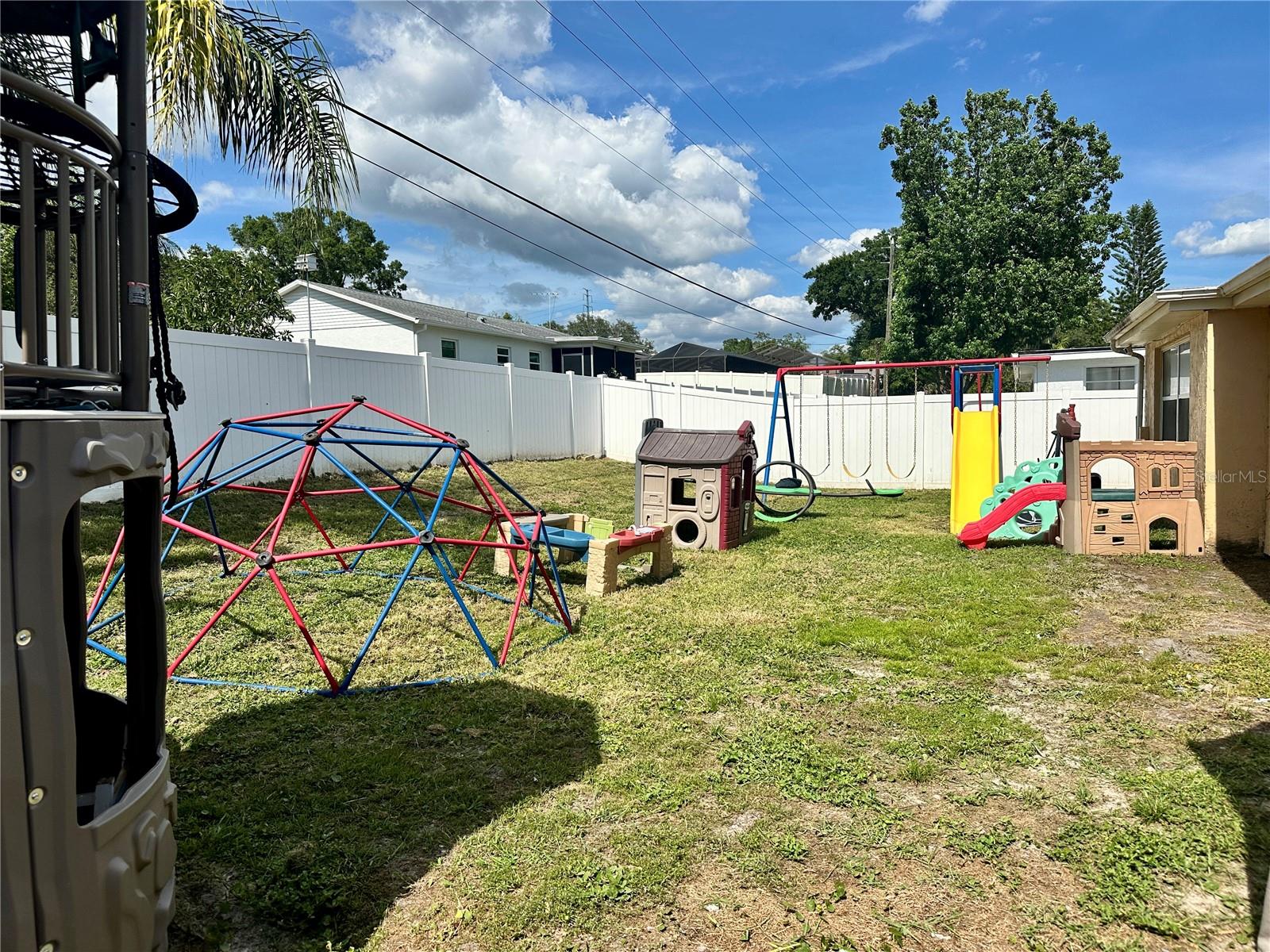 White Vinyl Fenced in Back Yard
