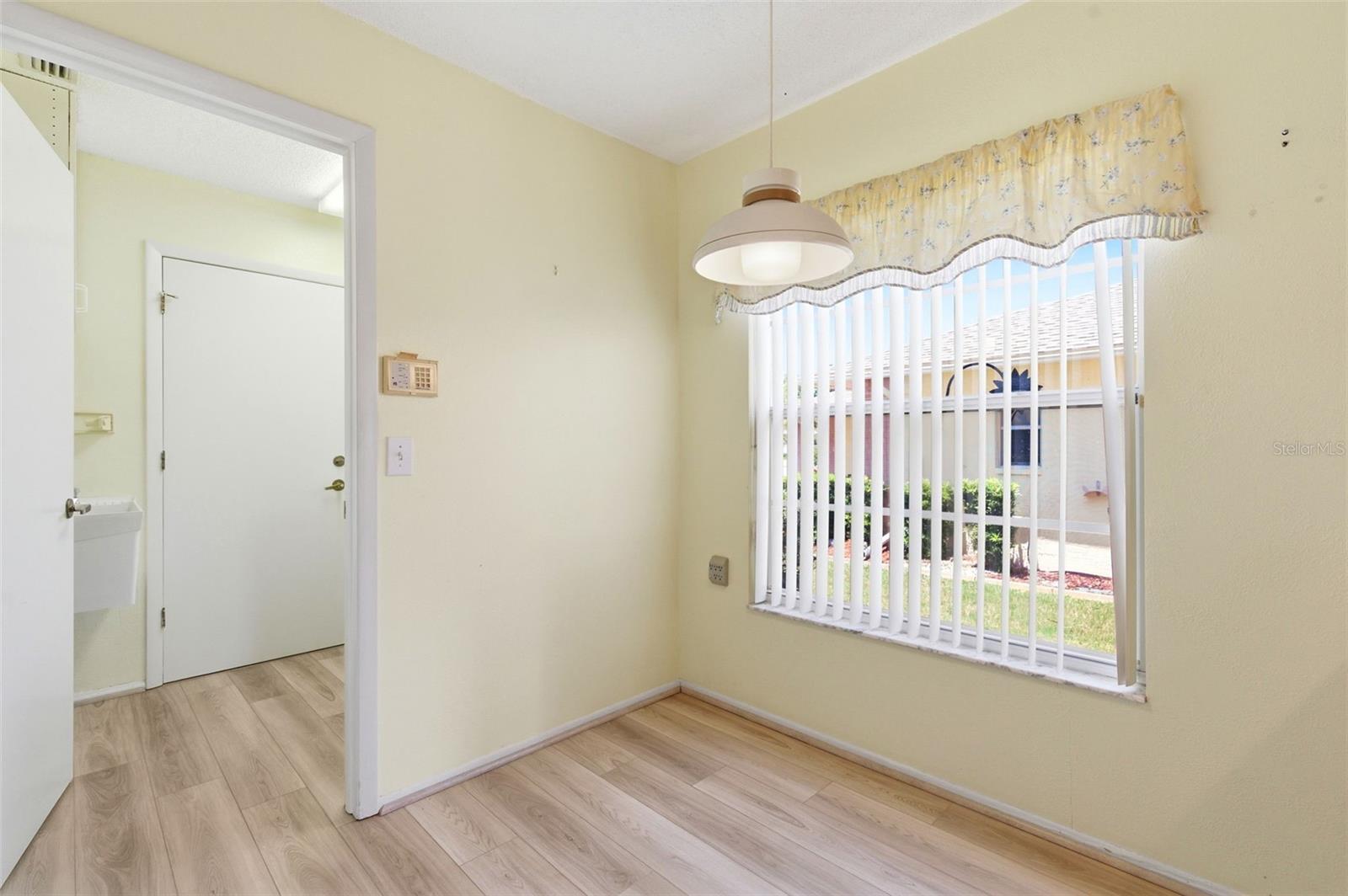 Eat in kitchen area, leading to inside laundry room