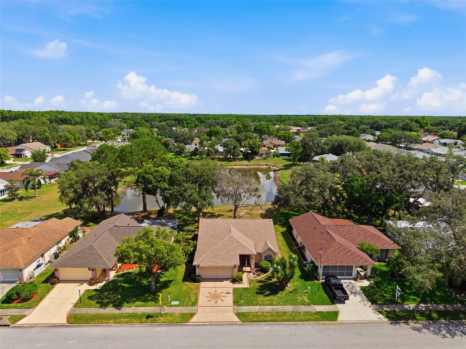 Aerial view of home and pond in back