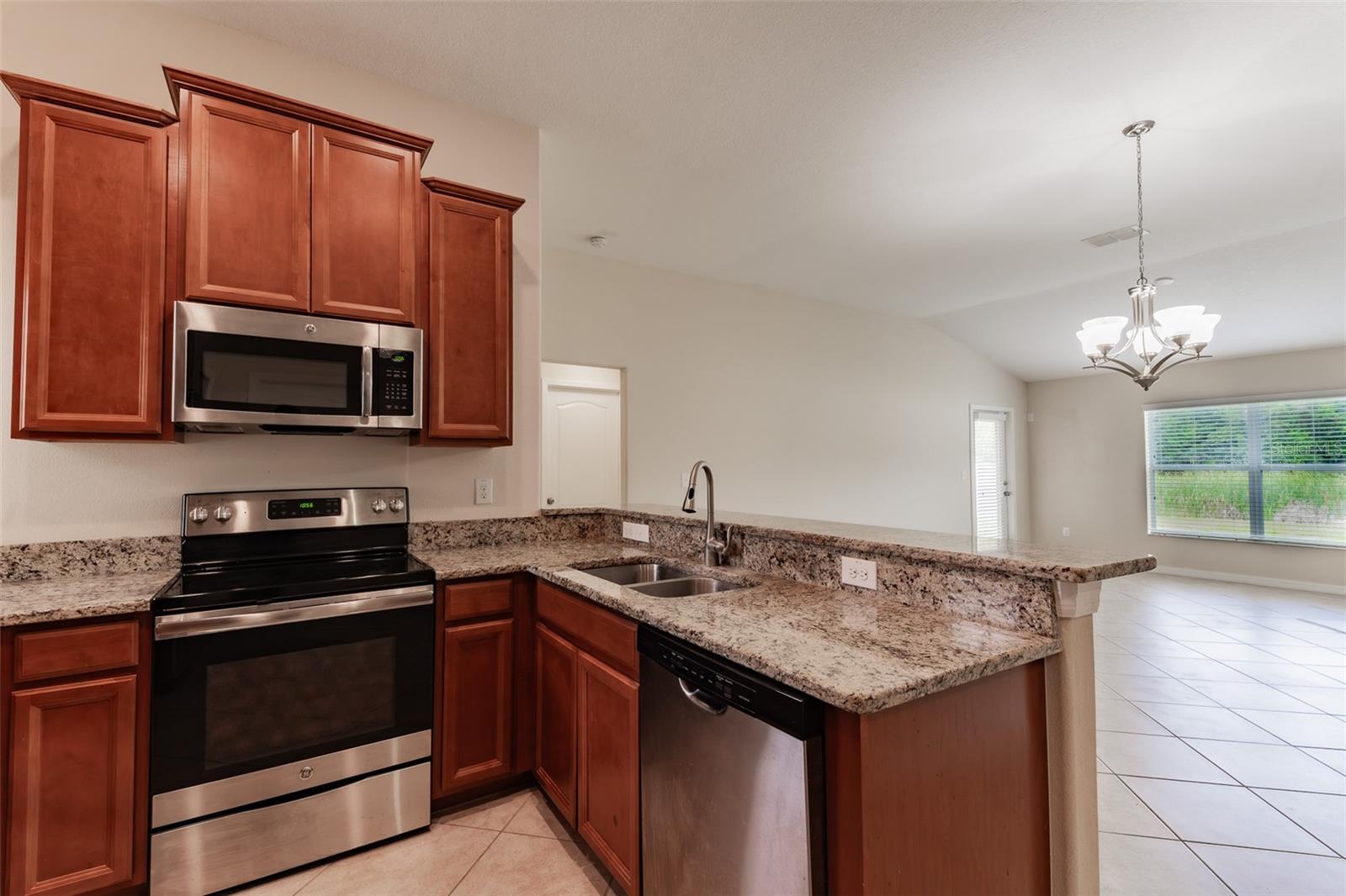 Kitchen looking to back of home.