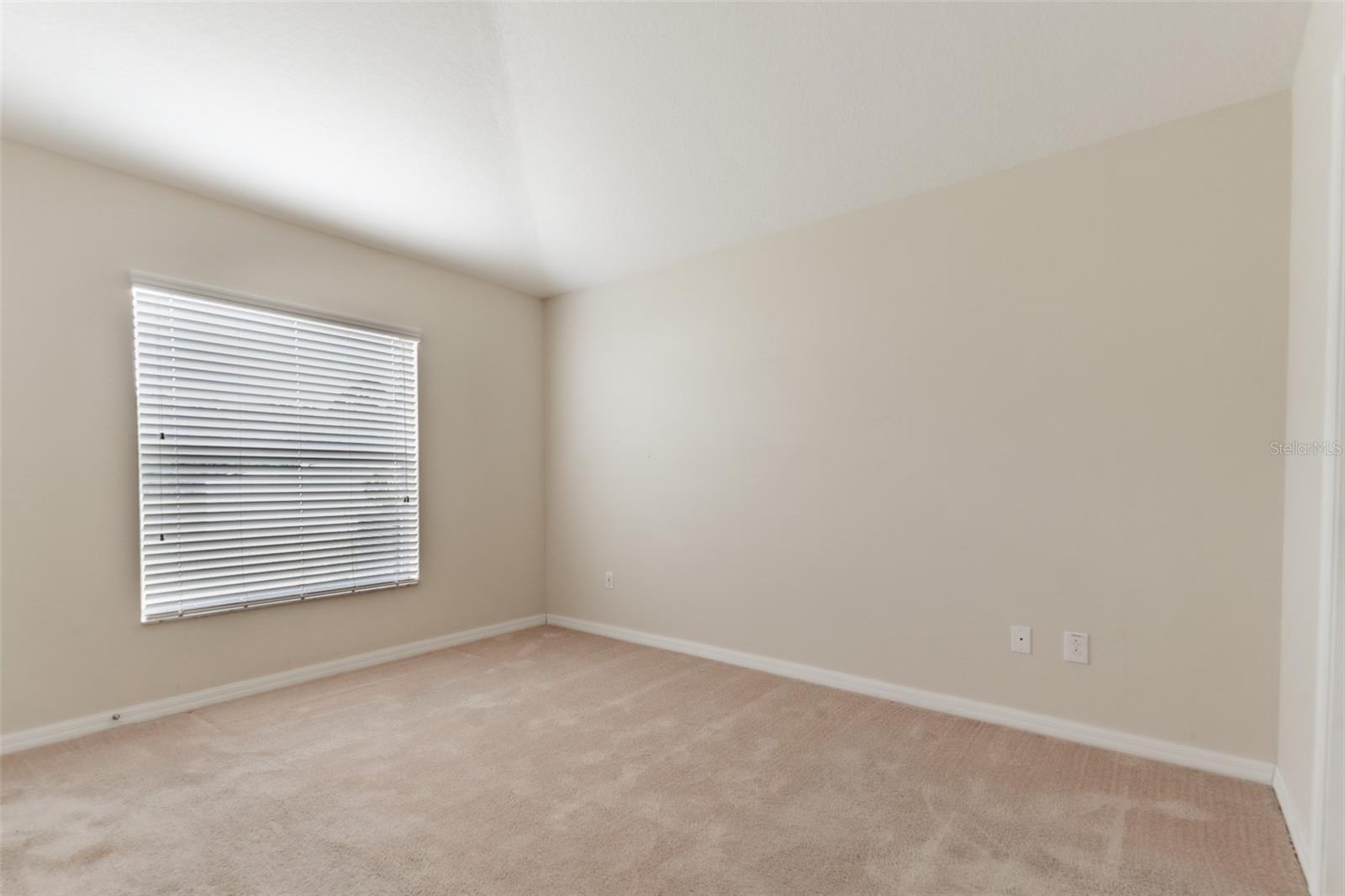 Primary Bedroom looking to backyard.