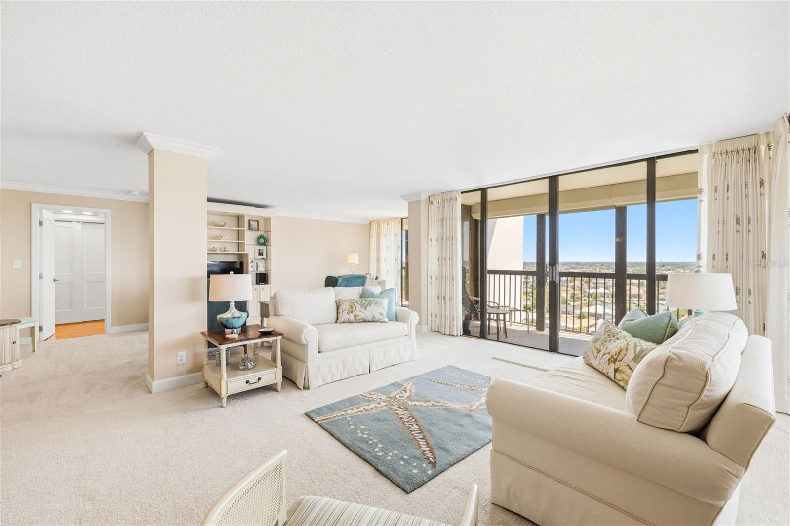 Living room and access to primary suite