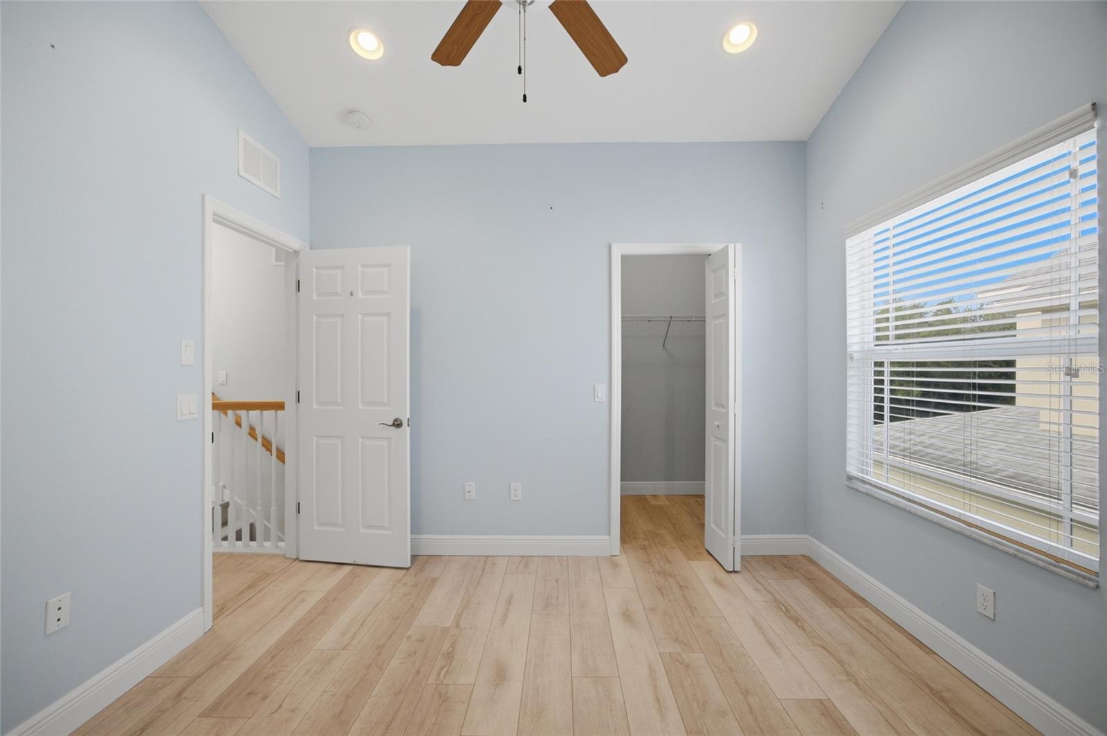 middle bedroom with walk in closet