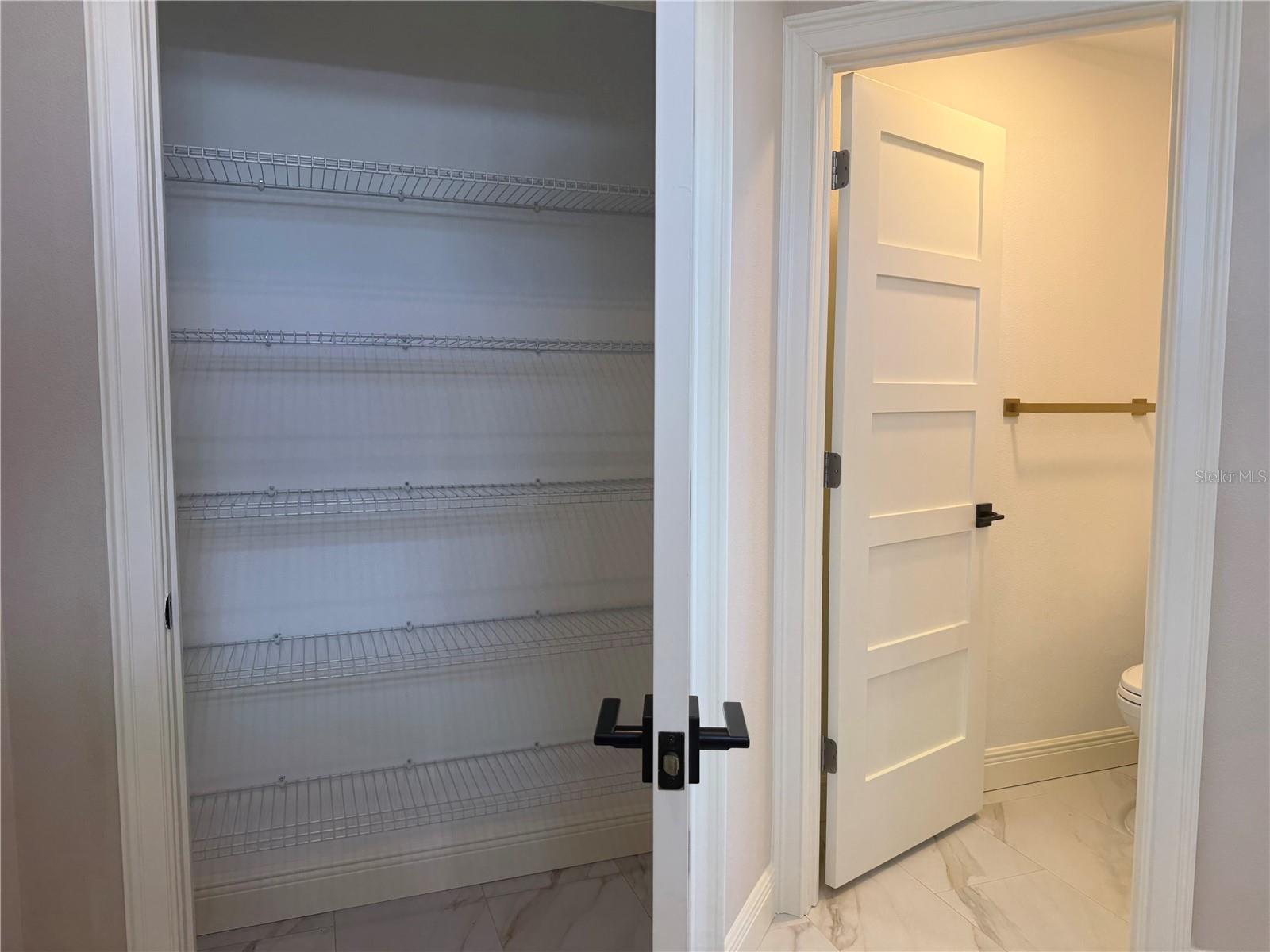 linen closet in primary bath