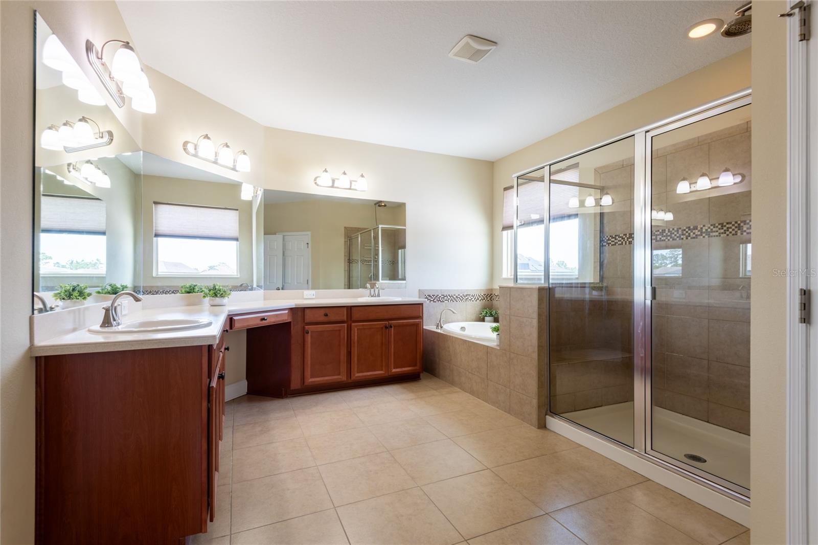 There is a door on the left side of the vanity that leads to the laundry room.