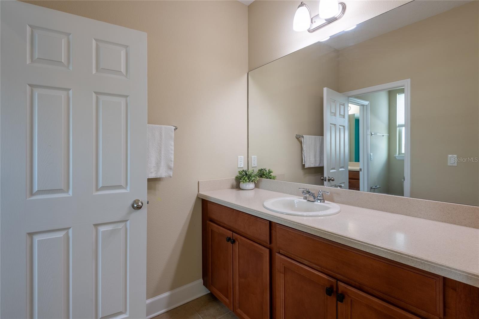 Bedrooms 2 and 3 share the Jack and Jill bath.