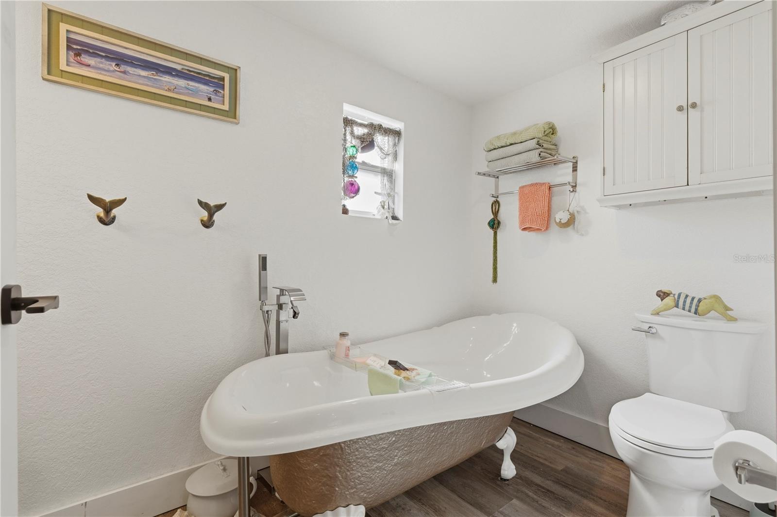 Custom full sized bathroom with claw foot tub.