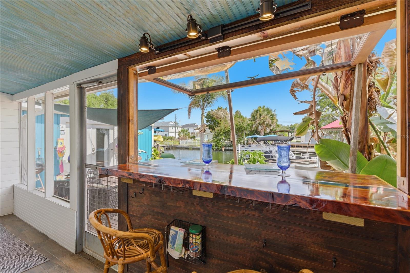 Custom Bar - exellent for entertaining - access to the outdoor open Patio, fire pit, Cabana and private EZDock on canal.
