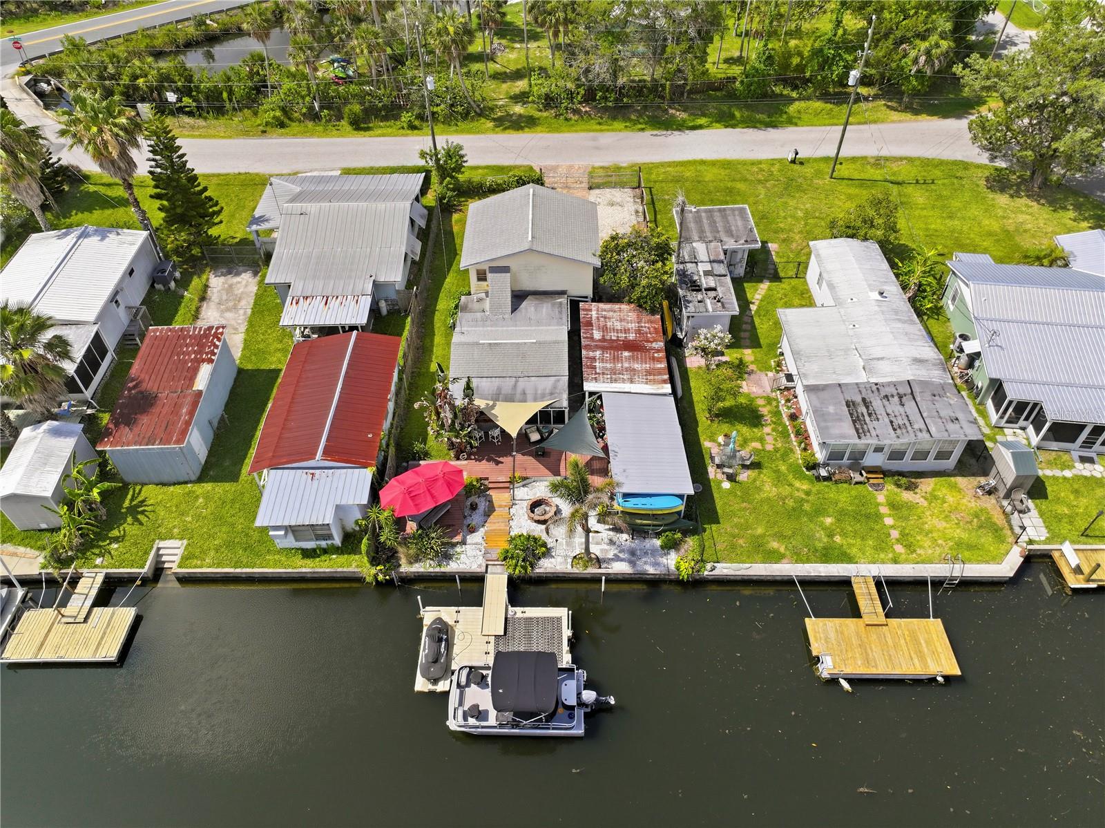 Aerial view - back of home with private EZDock on Canal.