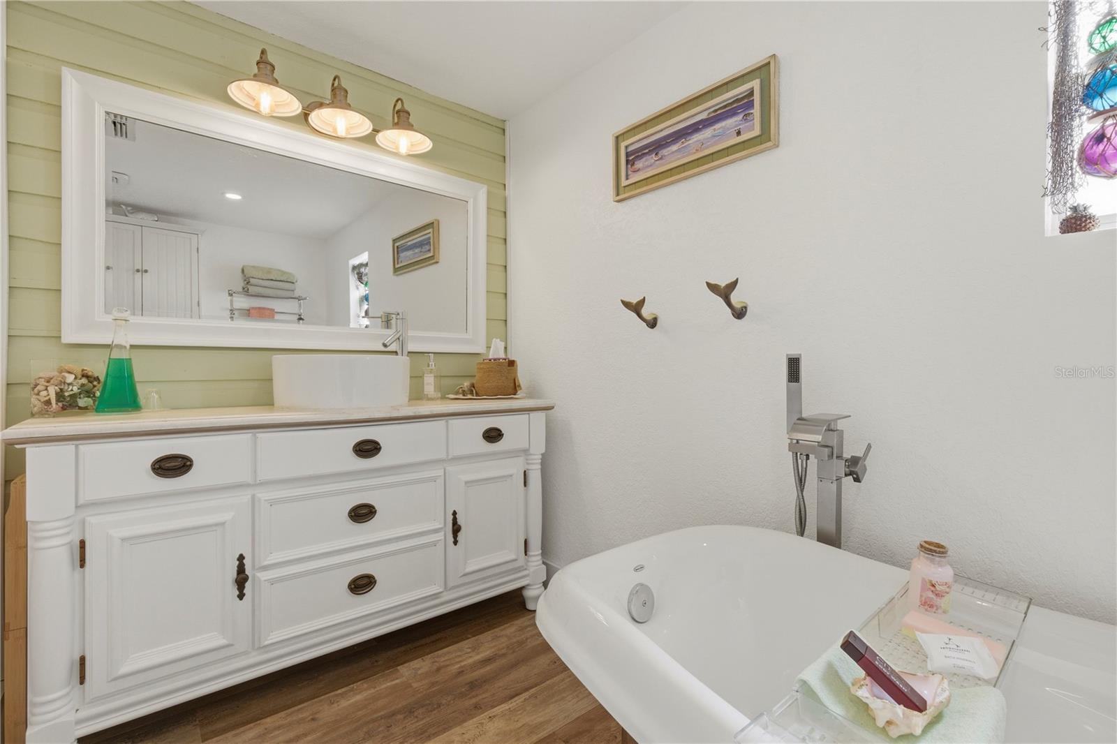 Custom full sized bathroom with claw foot tub.
