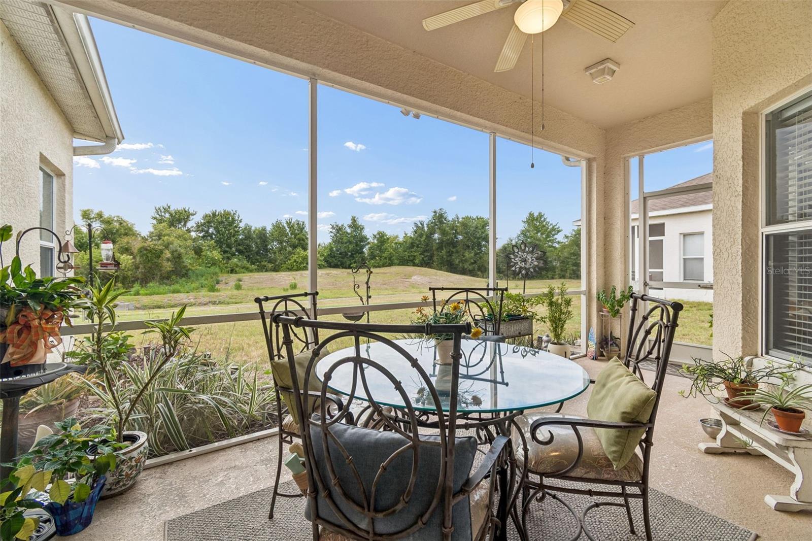 Large screen porch with conservation view and ceiling fan to keep you cool